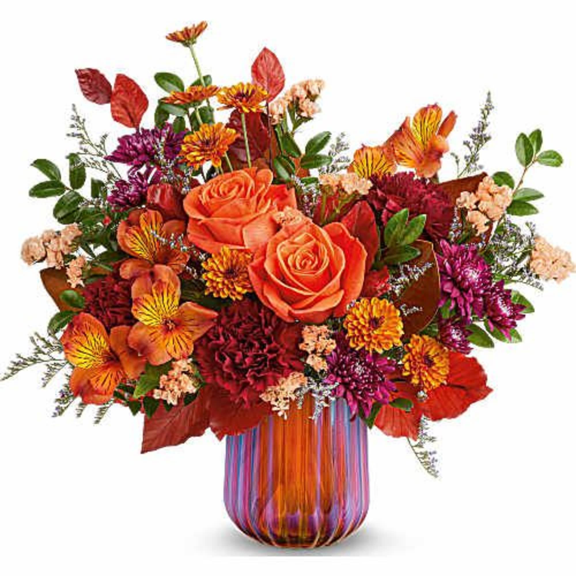 Teleflora's Amber Glow Bouquet radiates warmth with vibrant autumn blooms gathered in