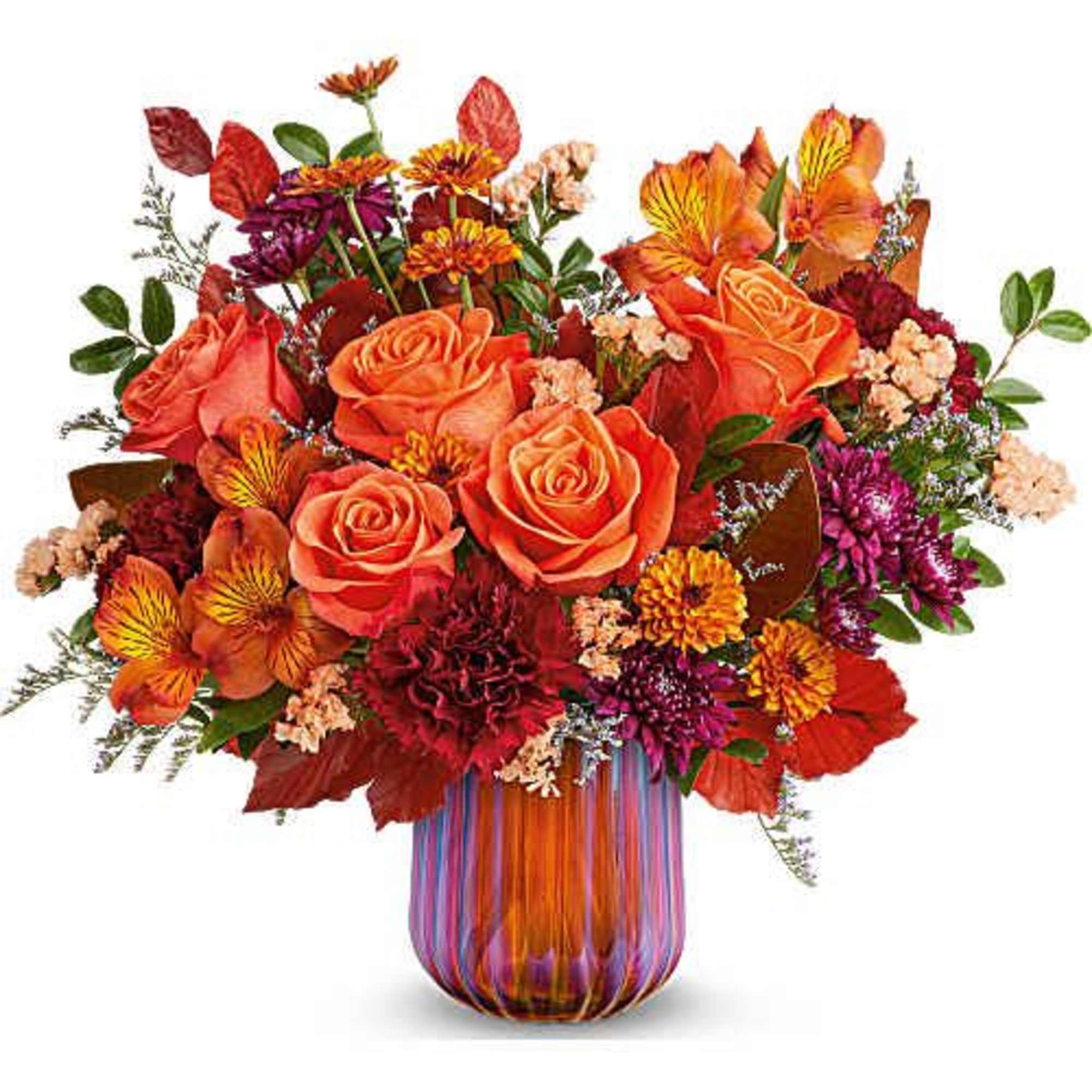 Teleflora's Amber Glow Bouquet radiates warmth with vibrant autumn blooms gathered in