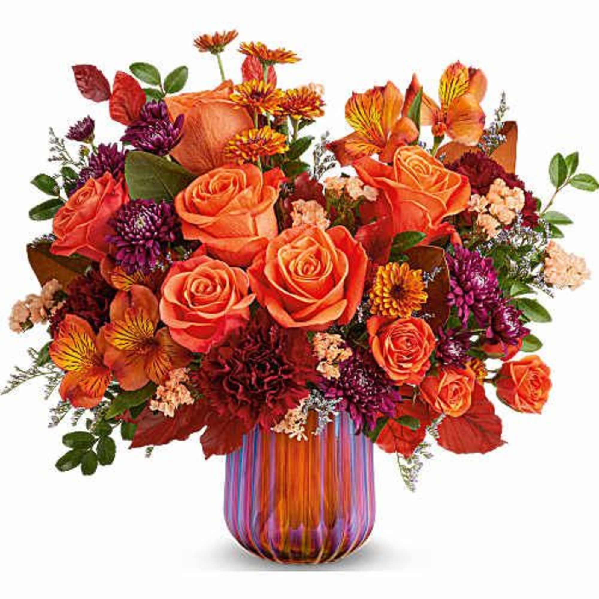 Teleflora's Amber Glow Bouquet radiates warmth with vibrant autumn blooms gathered in