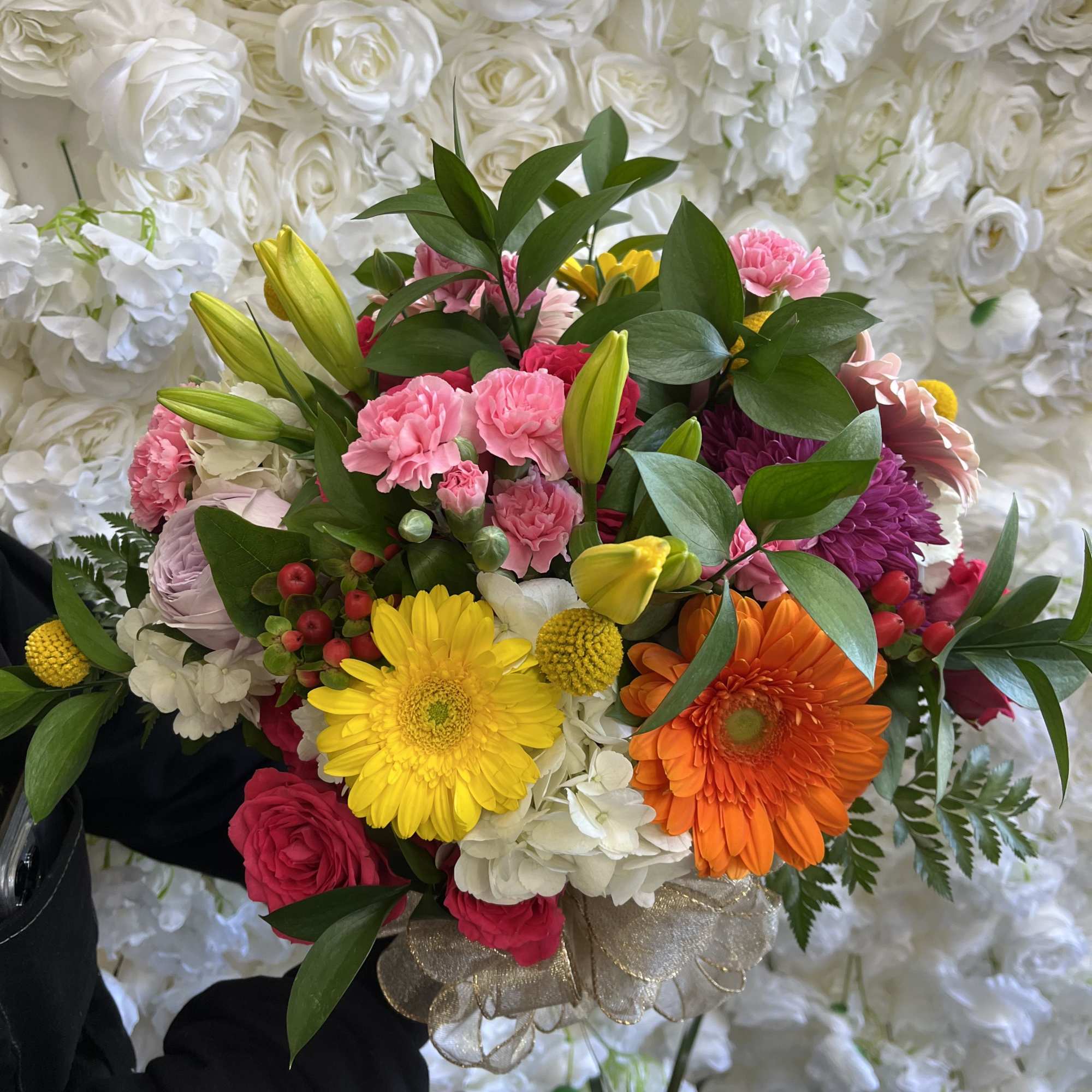 Colorful bouquet with gerbera daisies, roses, and carnations