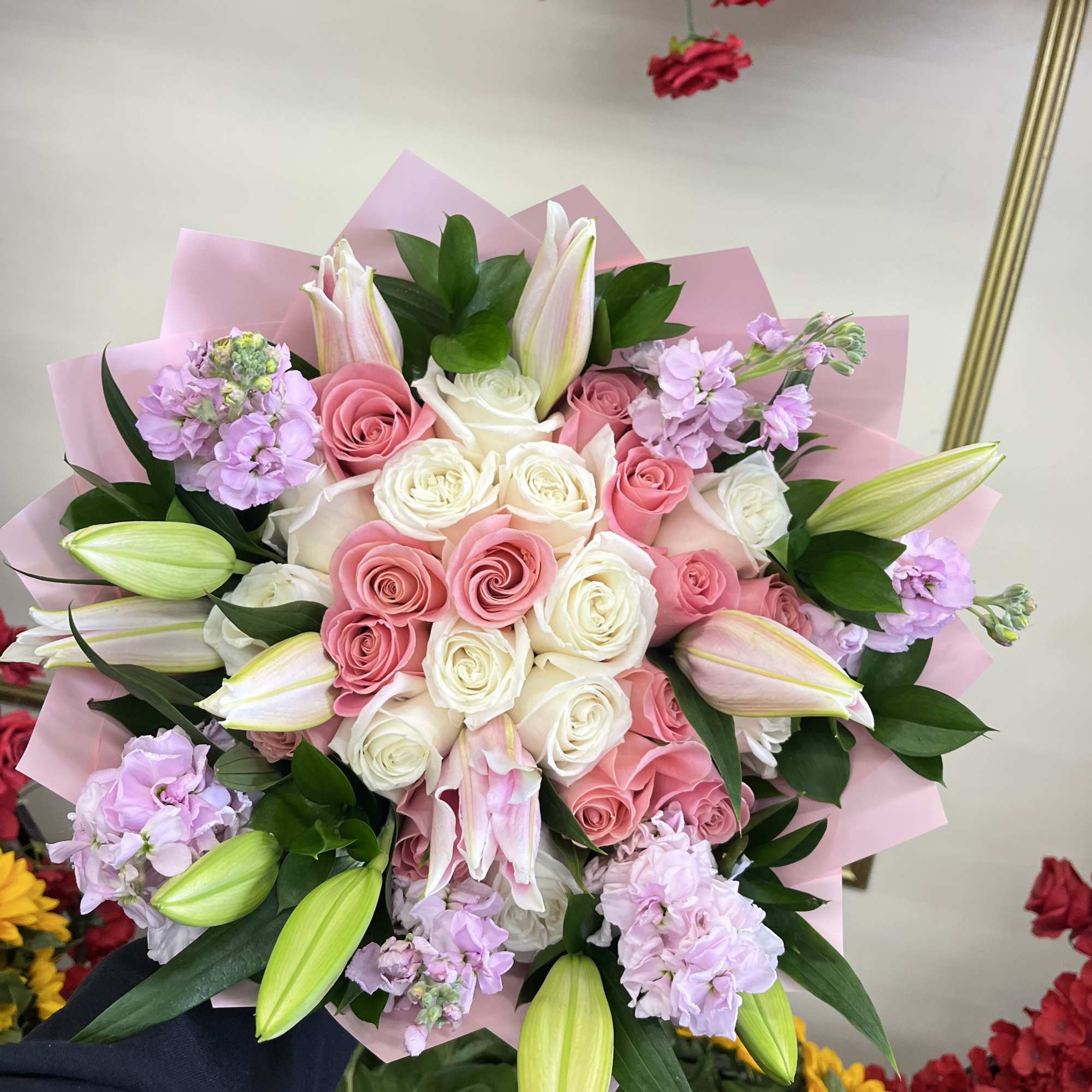 Pink and white rose bouquet with lilies and lavender flowers