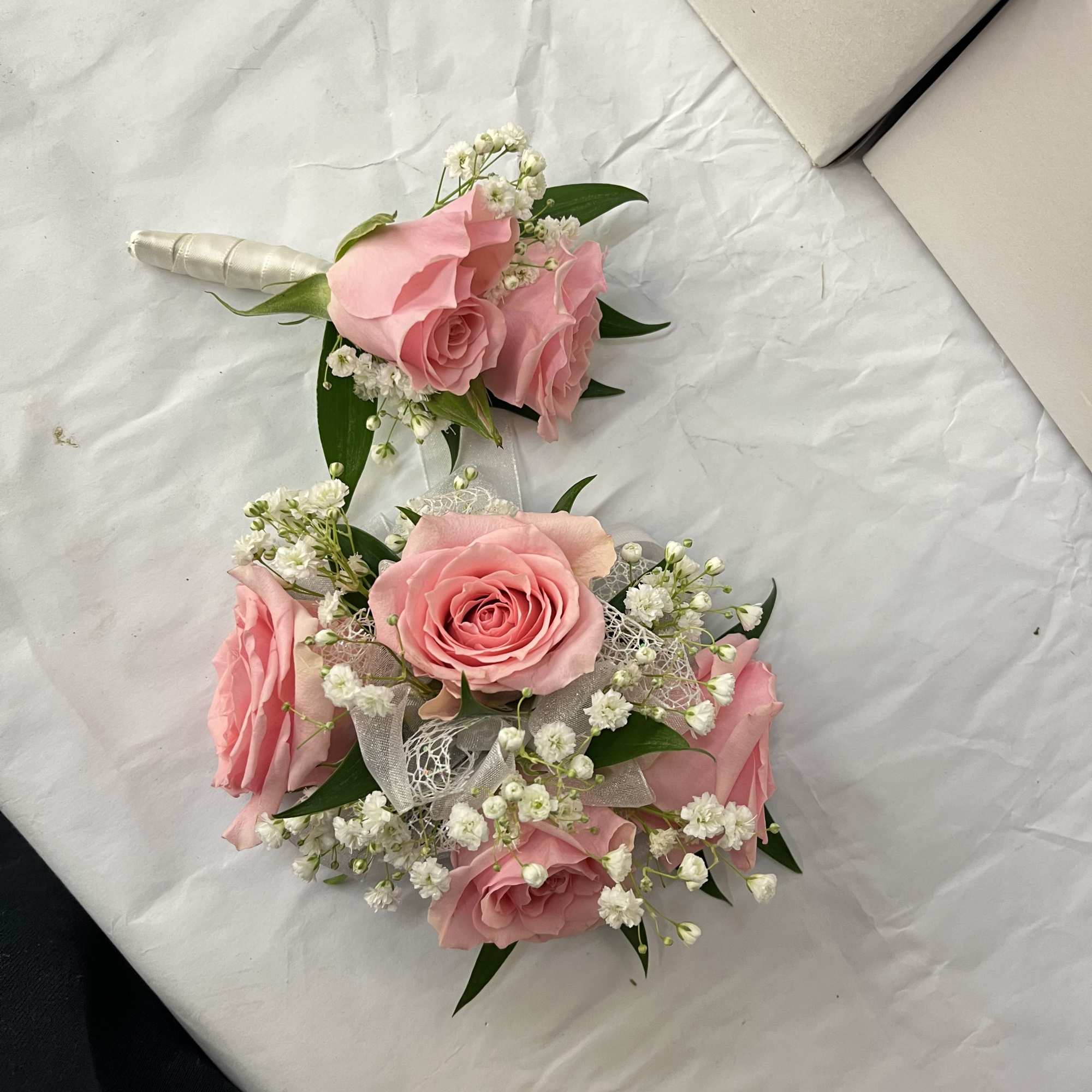 Pink rose corsage and boutonniere set for a soft, romantic look. The