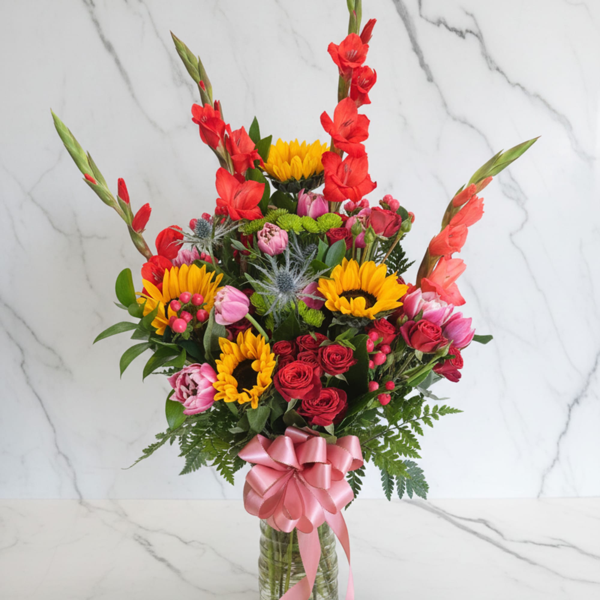 A bold, tropical-inspired arrangement designed with rich and vibrant tones. This piece