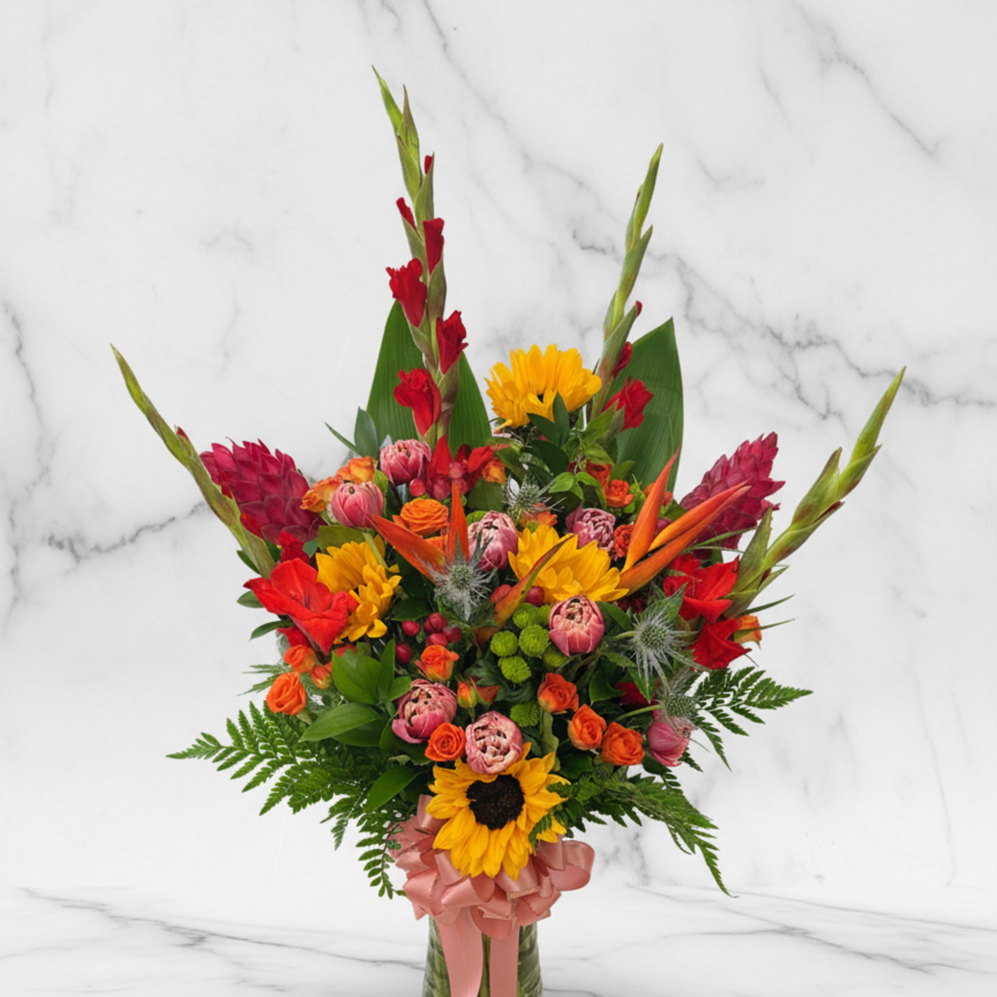 A bold, tropical-inspired arrangement designed with rich and vibrant tones. This piece
