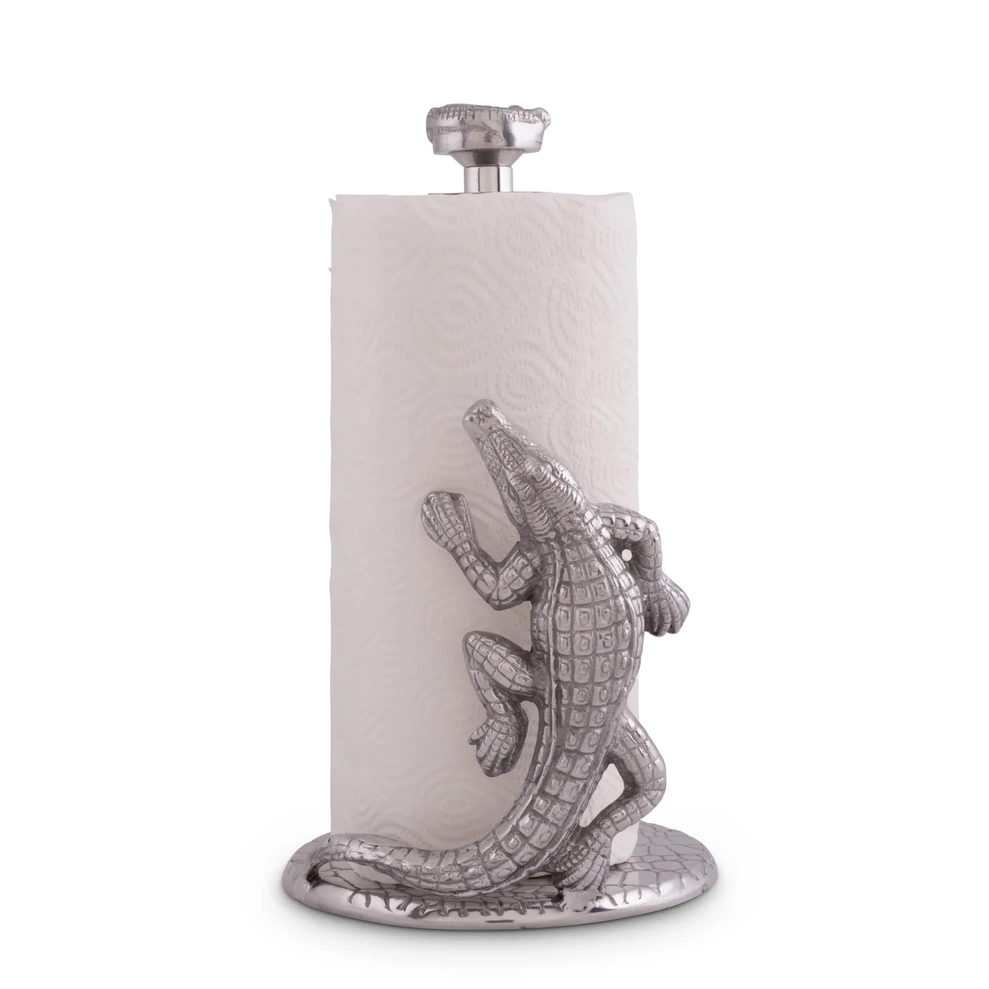 A sculptural silver alligator wraps playfully around a tall white paper towel