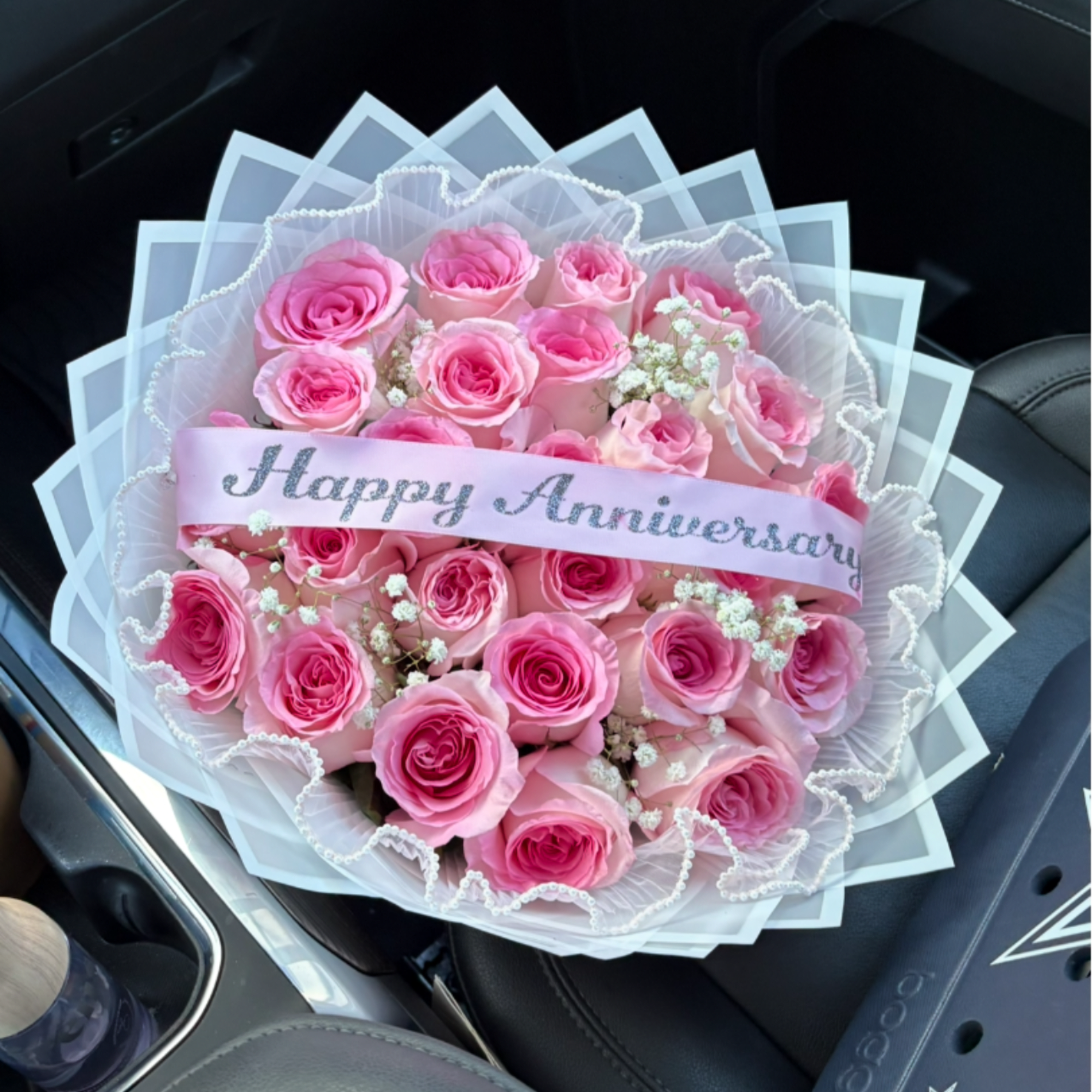 Pink rose bouquet with a Happy Anniversary ribbon