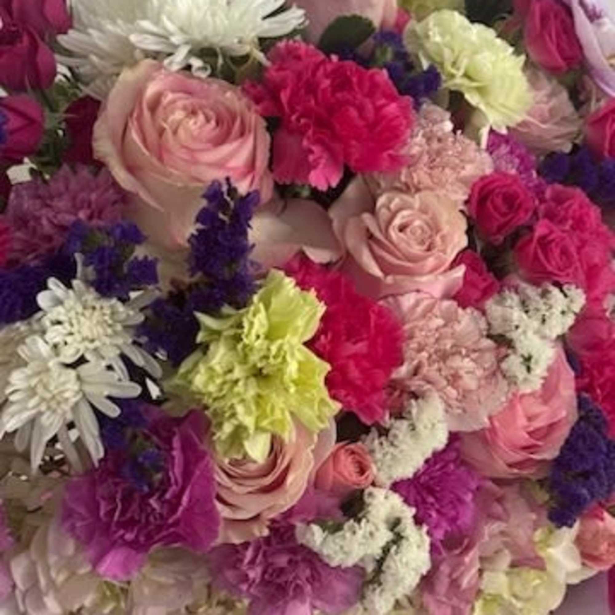A lush, rounded bouquet arranged inside a round pink hat box-this gift-ready, photo 2 of 2