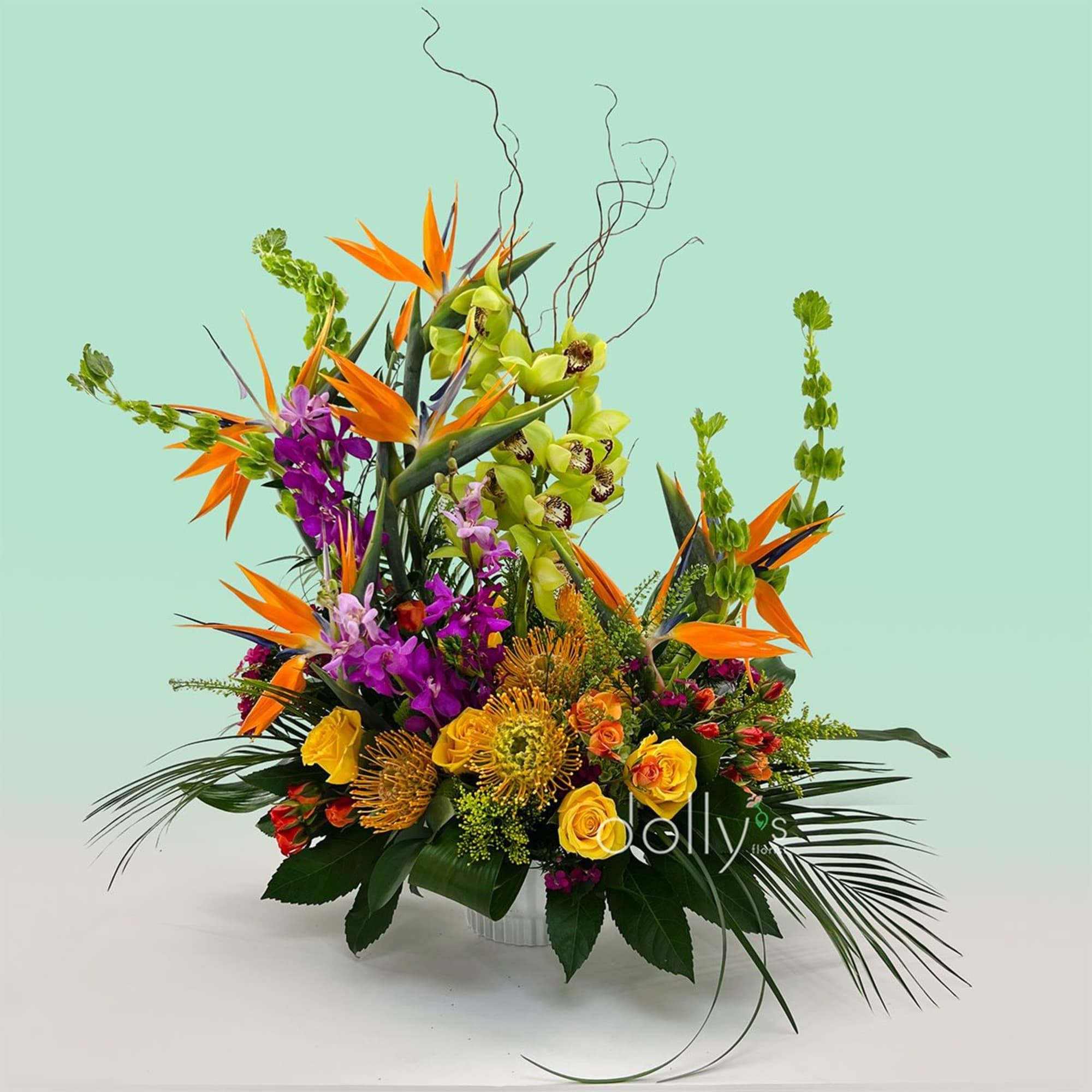 Bold, exotic, and unmistakably festive - this large tropical arrangement is a