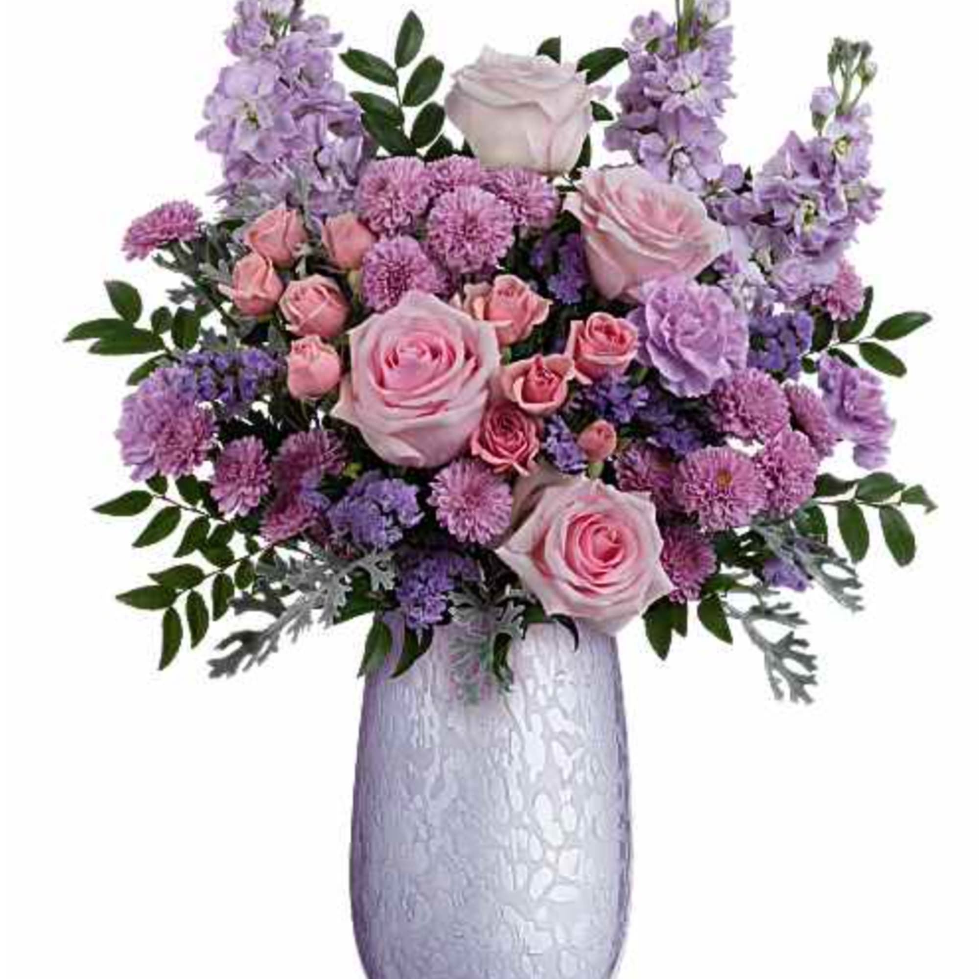 What a treat! Overflowing with pink roses and lavender blooms, this stunning