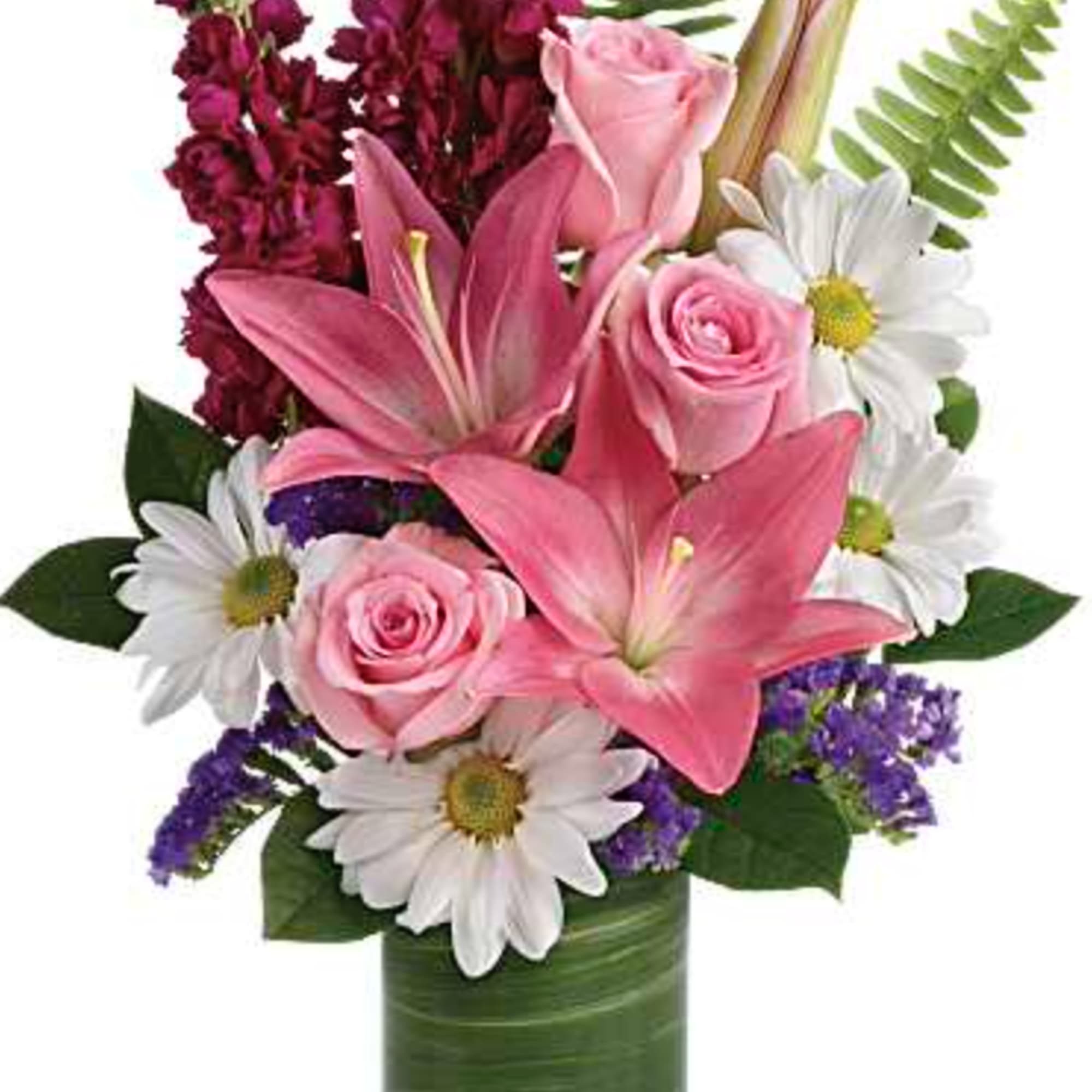Bright white daisies dance with happy pink lilies and fabulous fuchsia stock