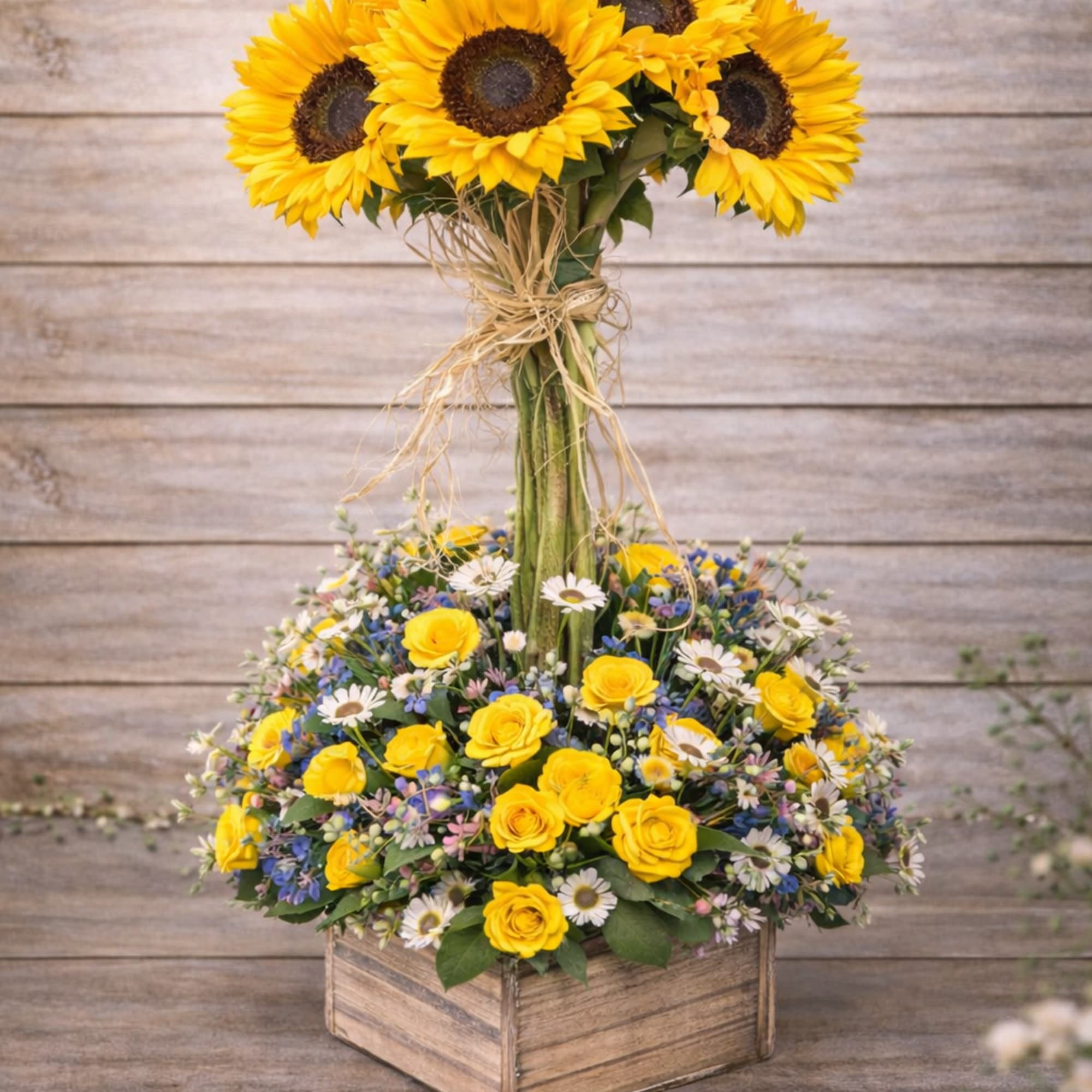 Sunflower and yellow rose arrangement in a wooden box