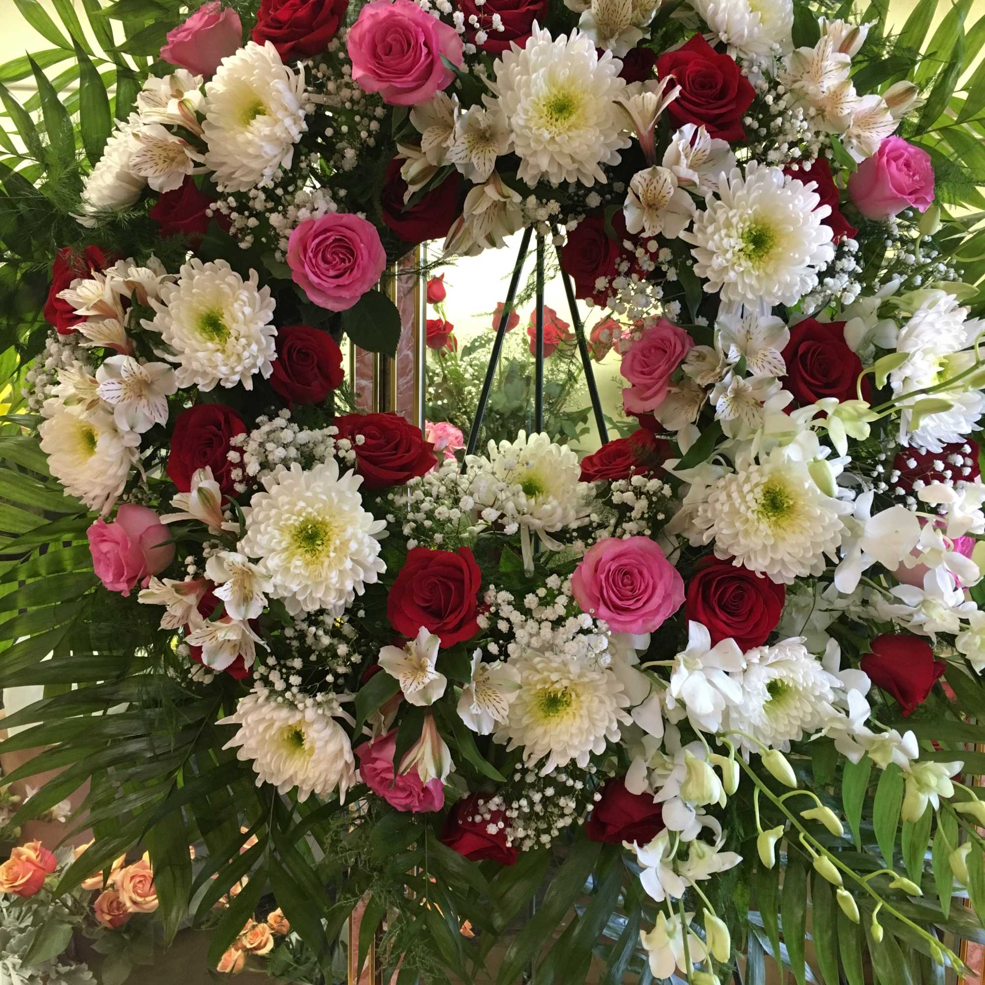 Pink &amp; Red Roses, Dendrobium Orchids, White Cremons, Fancy Assorted Greens, Babies