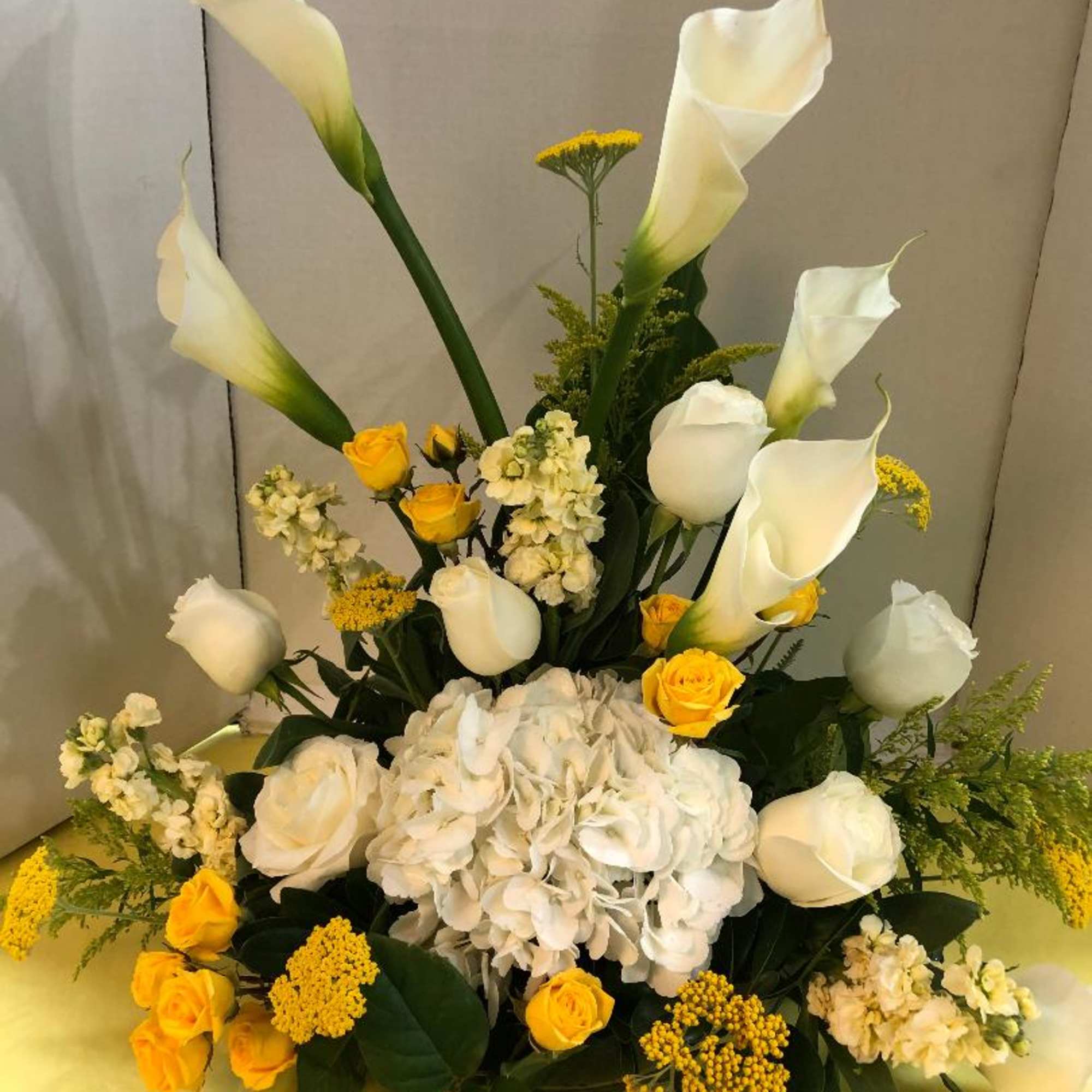 White Calla Lilies,White Roses Yellow Asiatic Lilies, White Hydrangea, Yellow Stock
Call Ahead