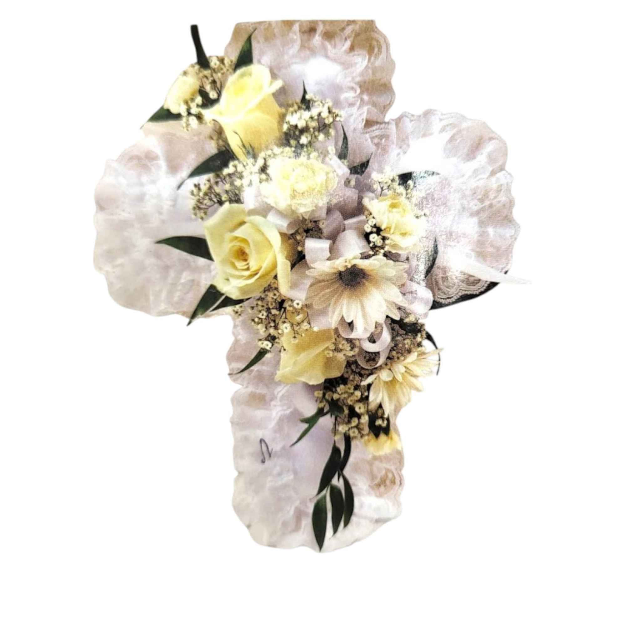 Cream floral cross arrangement with pale yellow roses and daisies