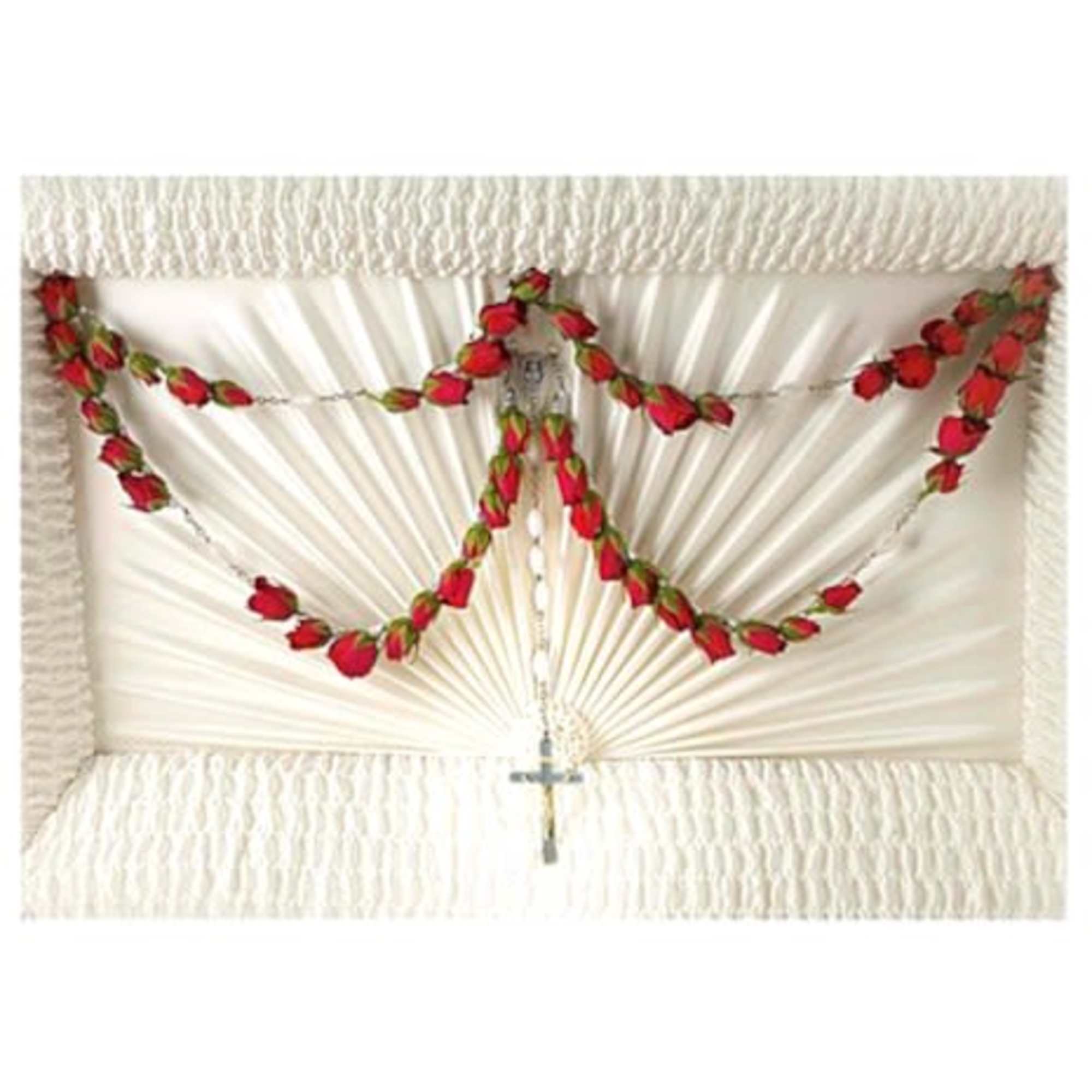 White casket spray with red rose garlands and a cross pendant