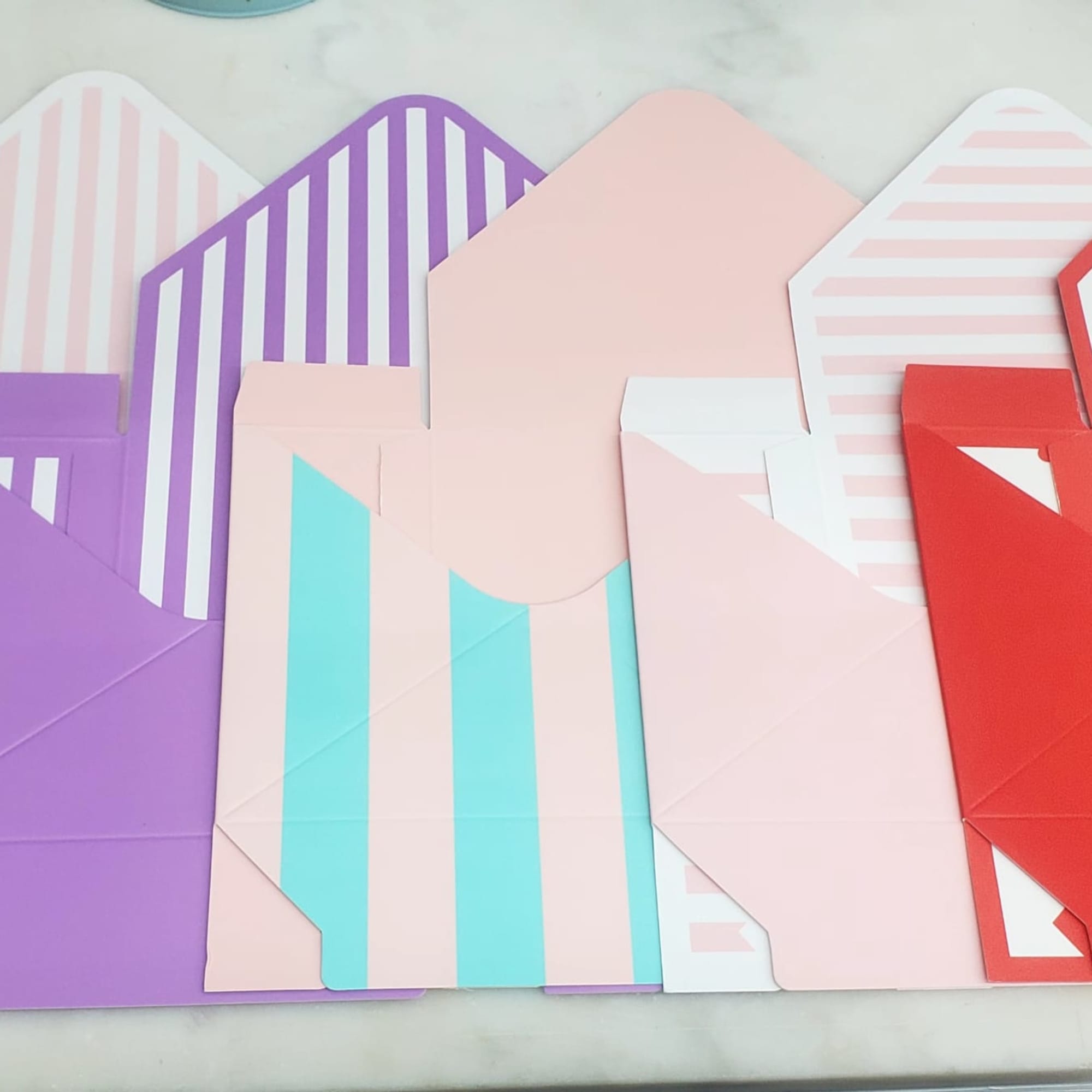 Colorful patterned envelopes arranged on a table