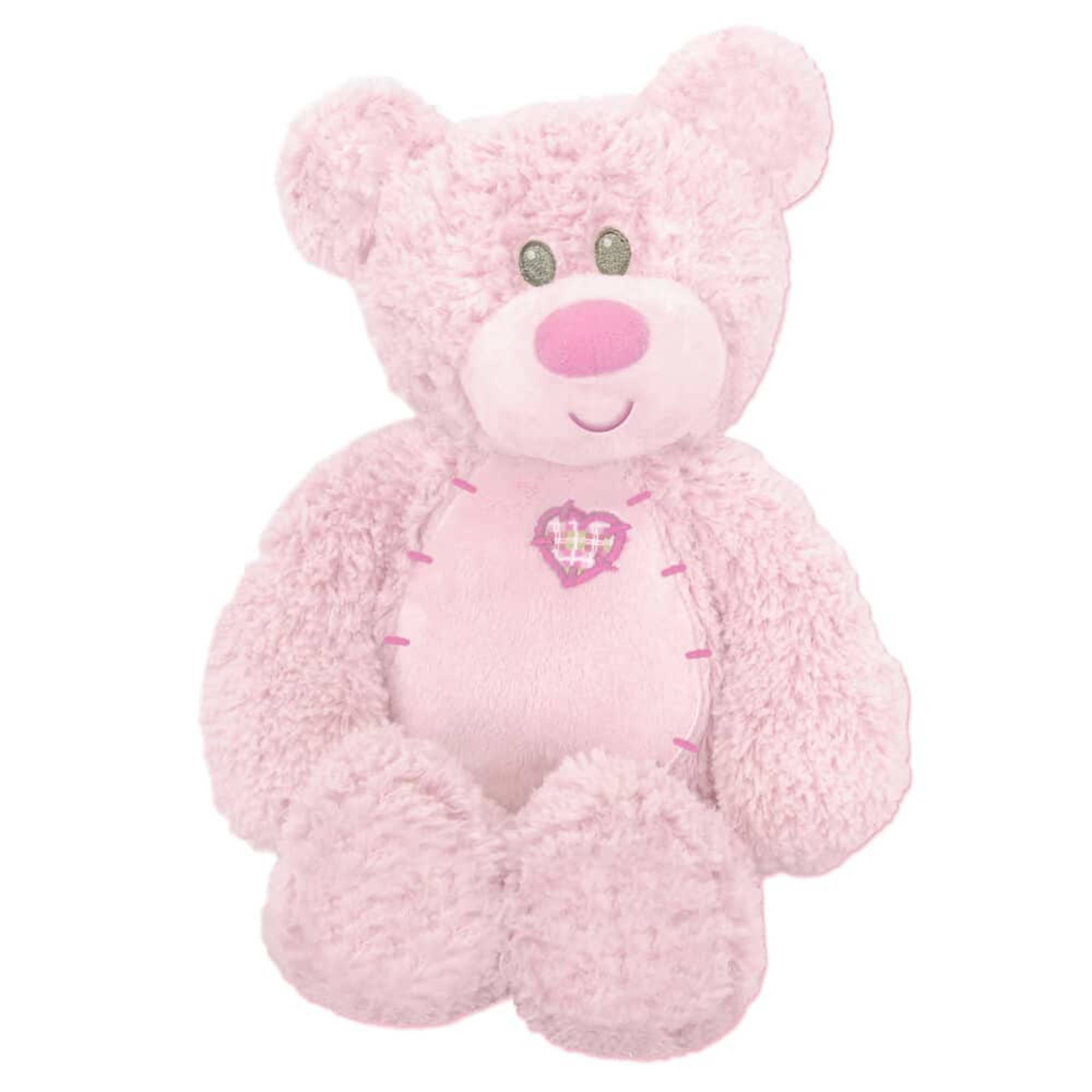 Pink teddy bear plush toy with a heart on its chest