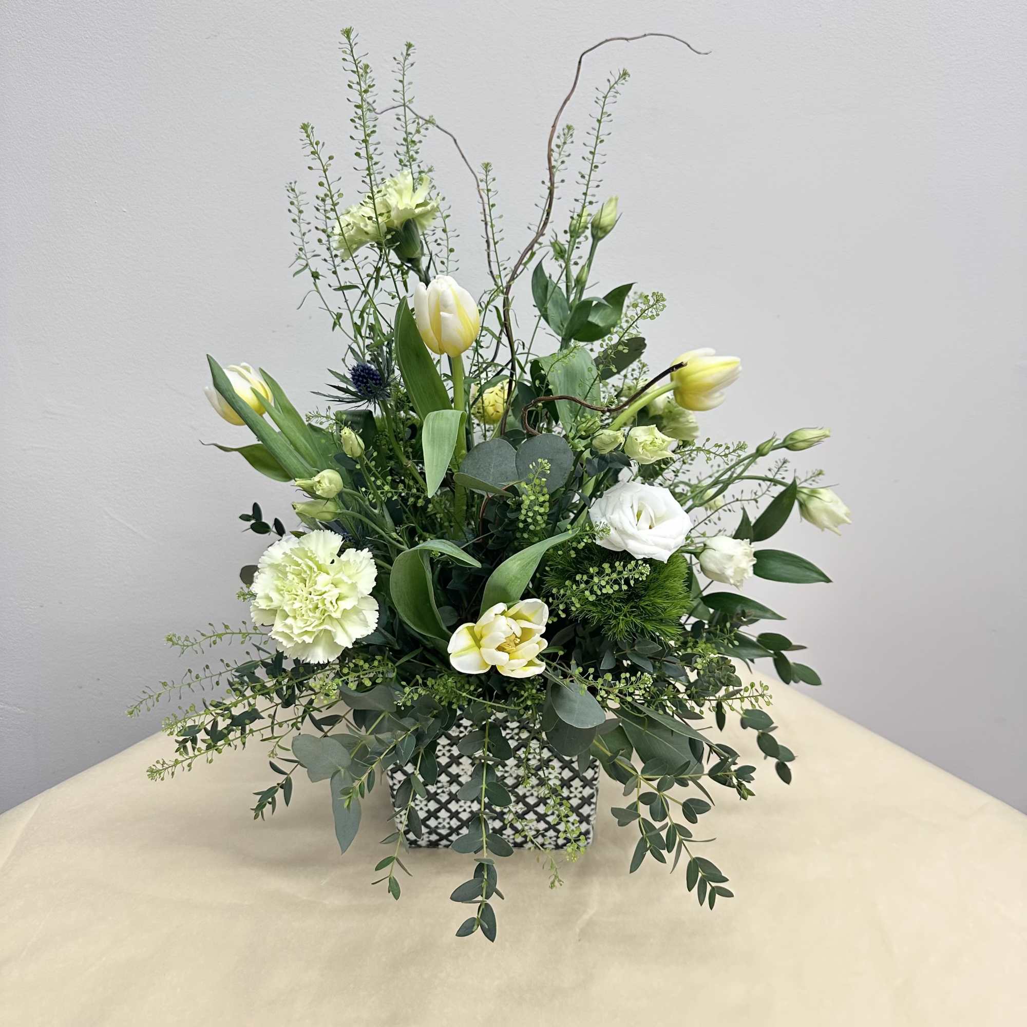 A whimsical mix of green, white and creamy wildflowers arranged in a, photo 2 of 2
