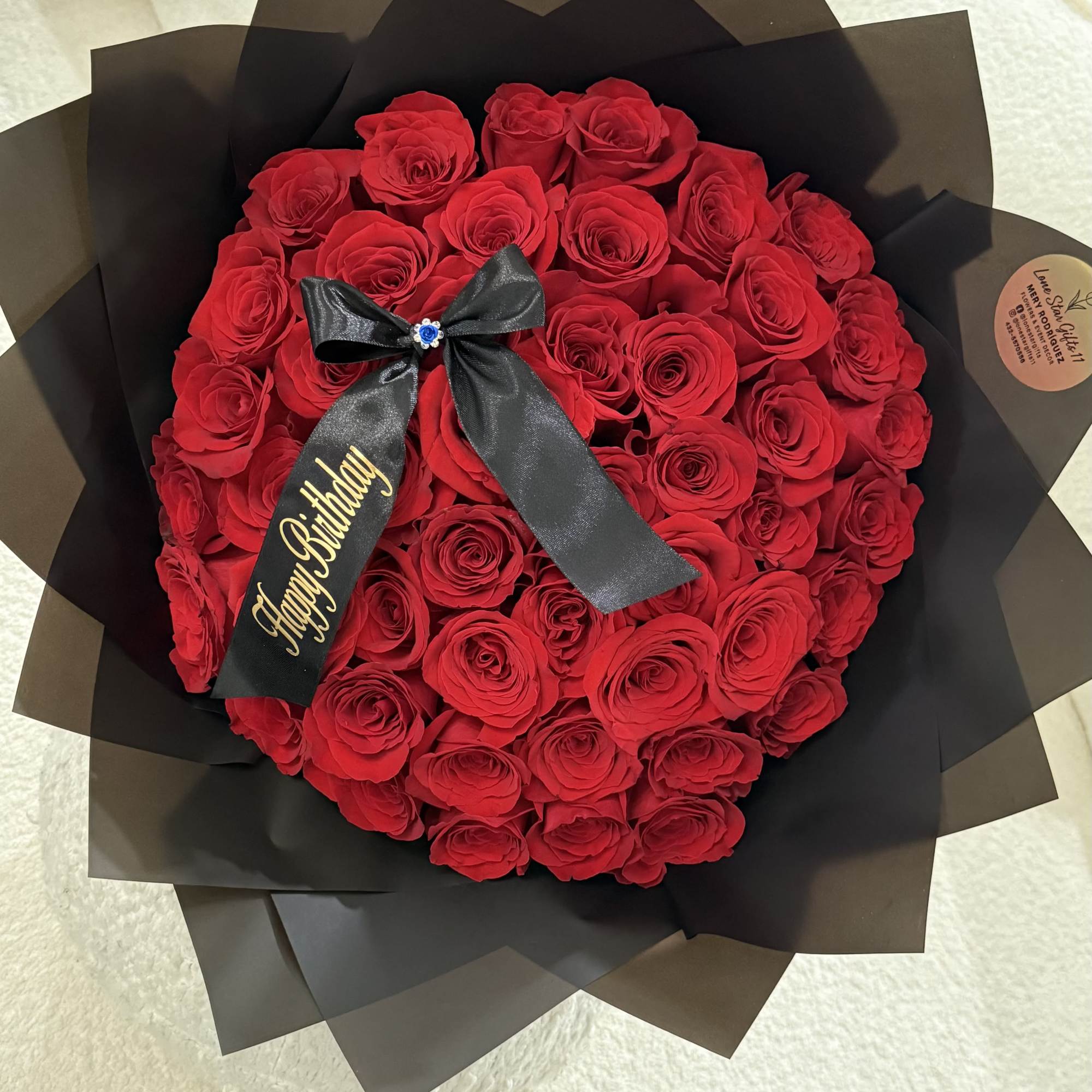 A timeless bouquet of 24 premium red roses, beautifully wrapped and finished