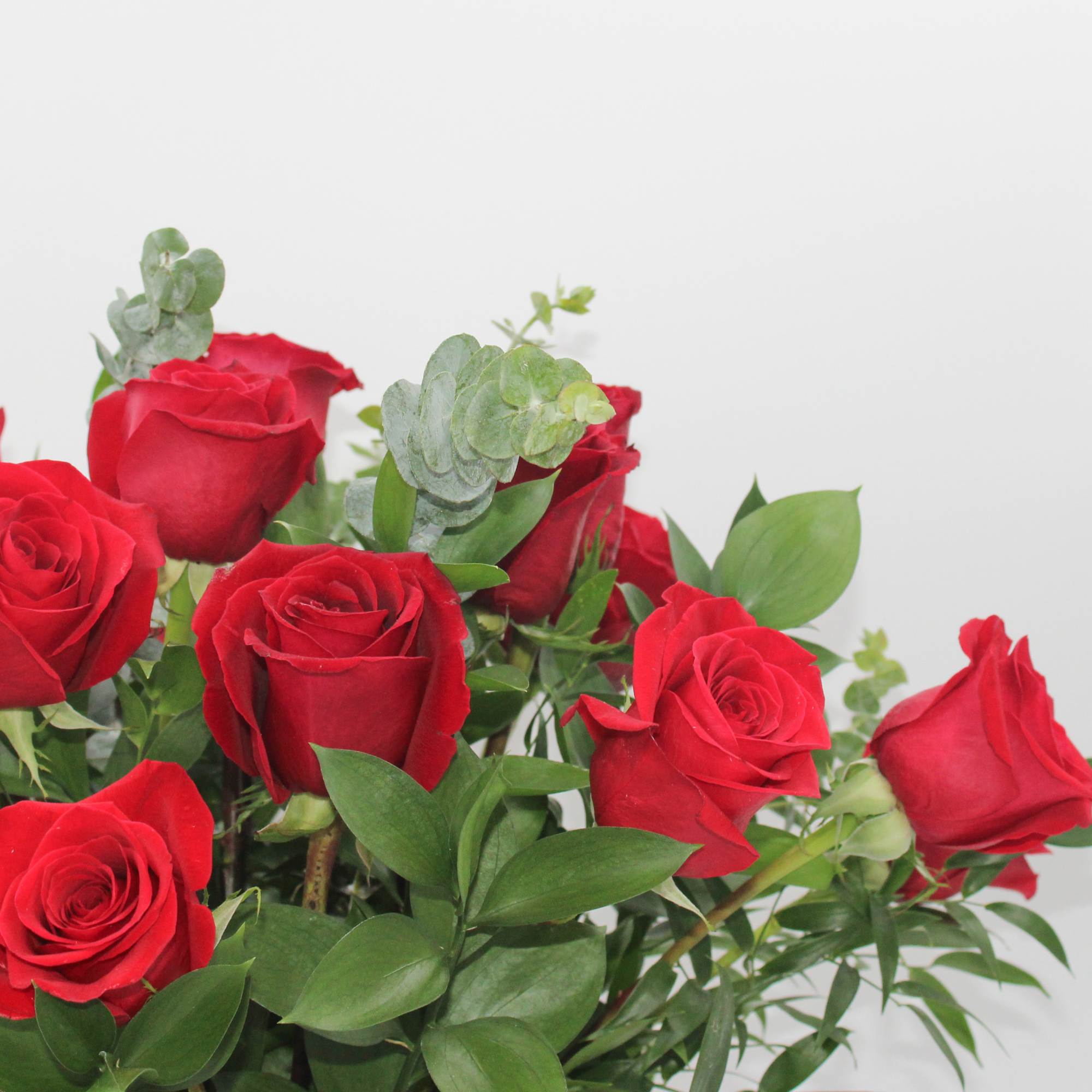 Bouquet of red roses with eucalyptus and greenery