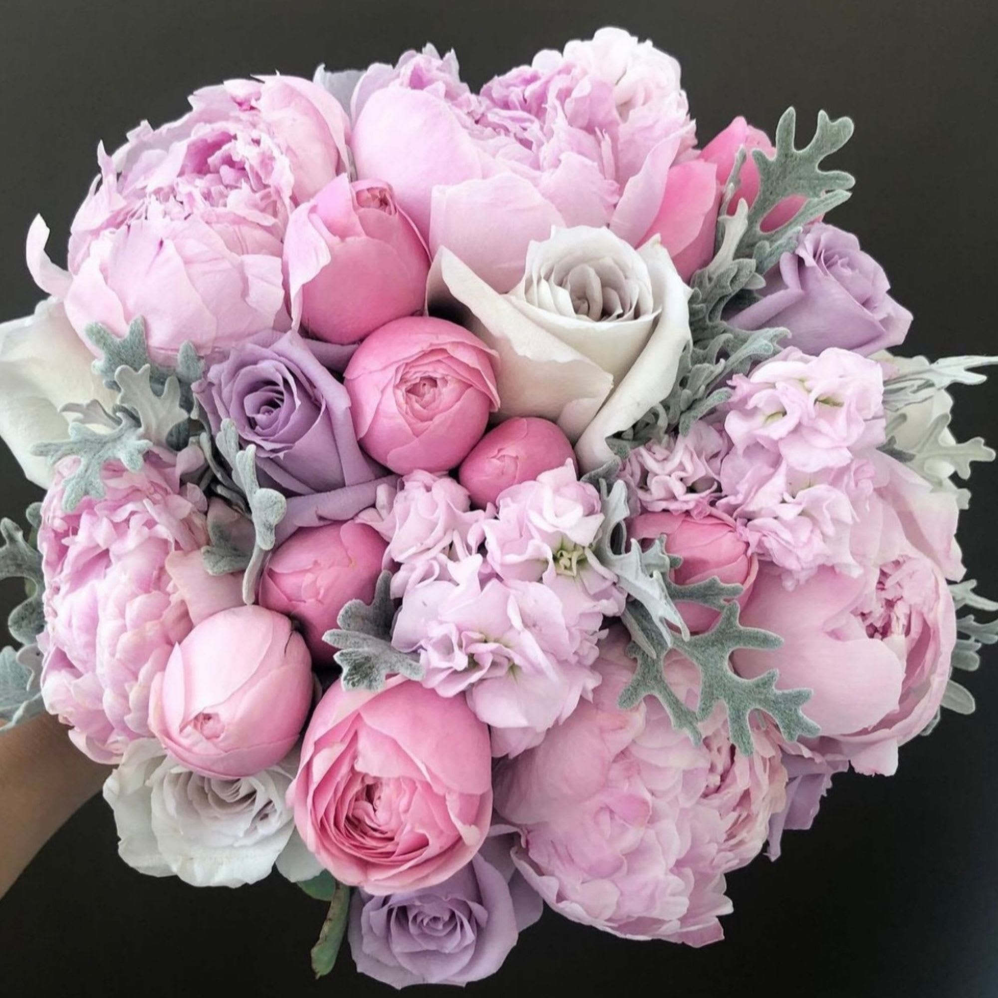 Pink and lavender bouquet with peonies and roses