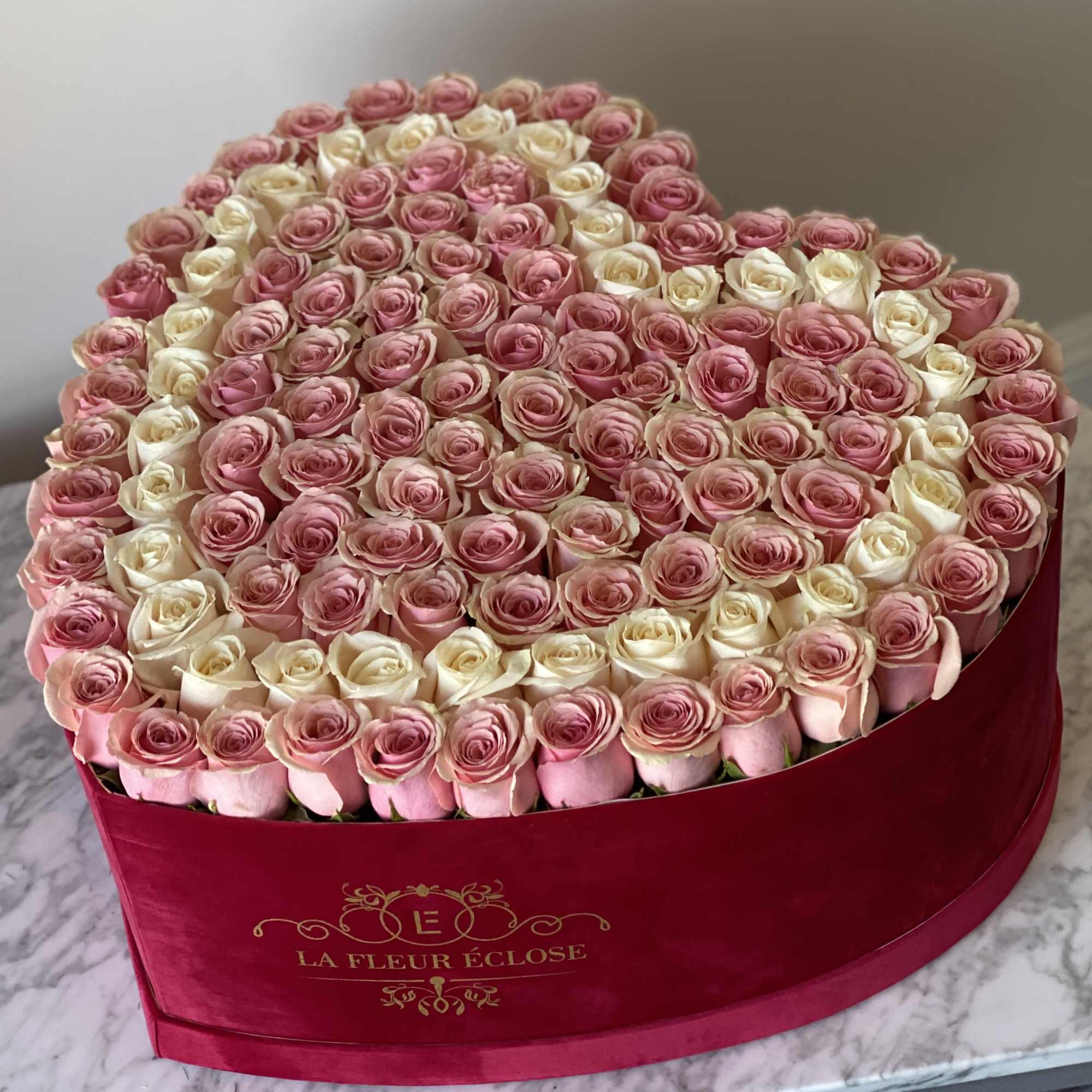 Heart-shaped box filled with pink and white roses, photo 2 of 2