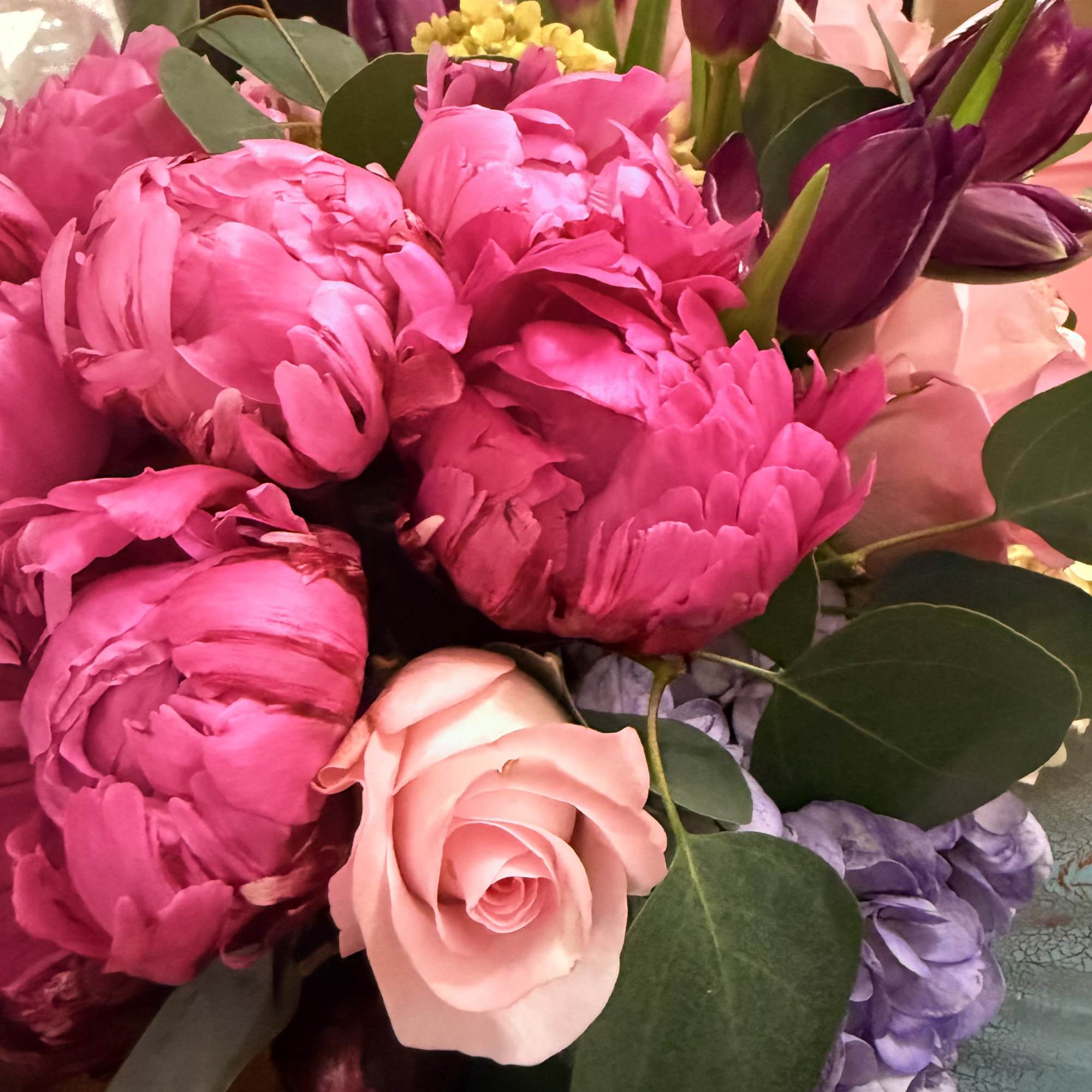 This Centerpiece/ arrangement is rich berry tones, delicate blush, and soft pastel