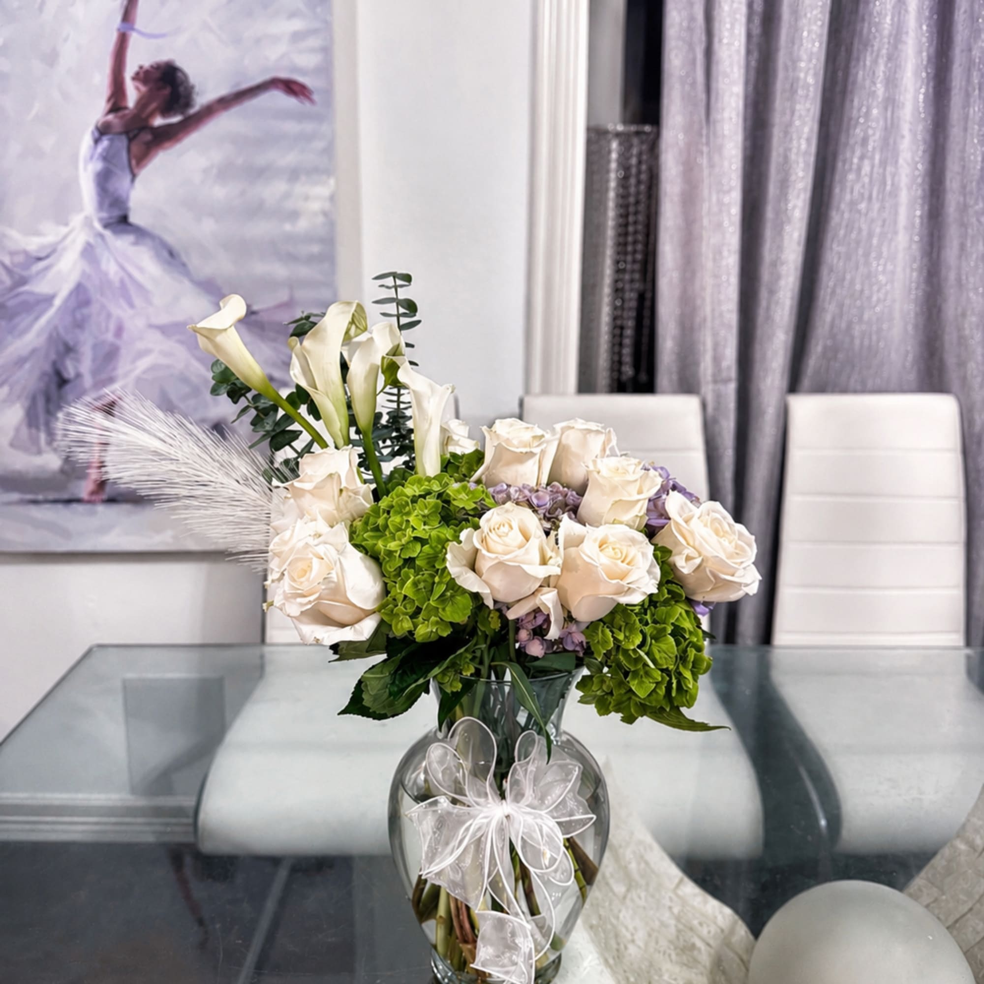 A luminous couture-style arrangement where ivory roses bloom like porcelain silk against
