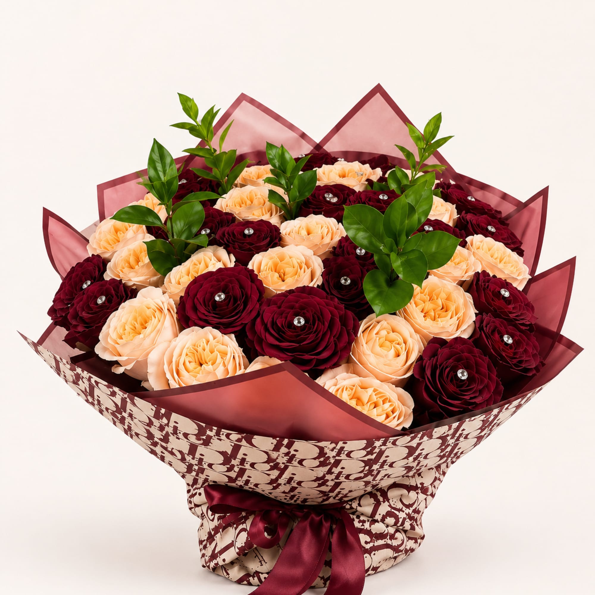 A lavish couture bouquet where deep velvet crimson roses entwine with soft