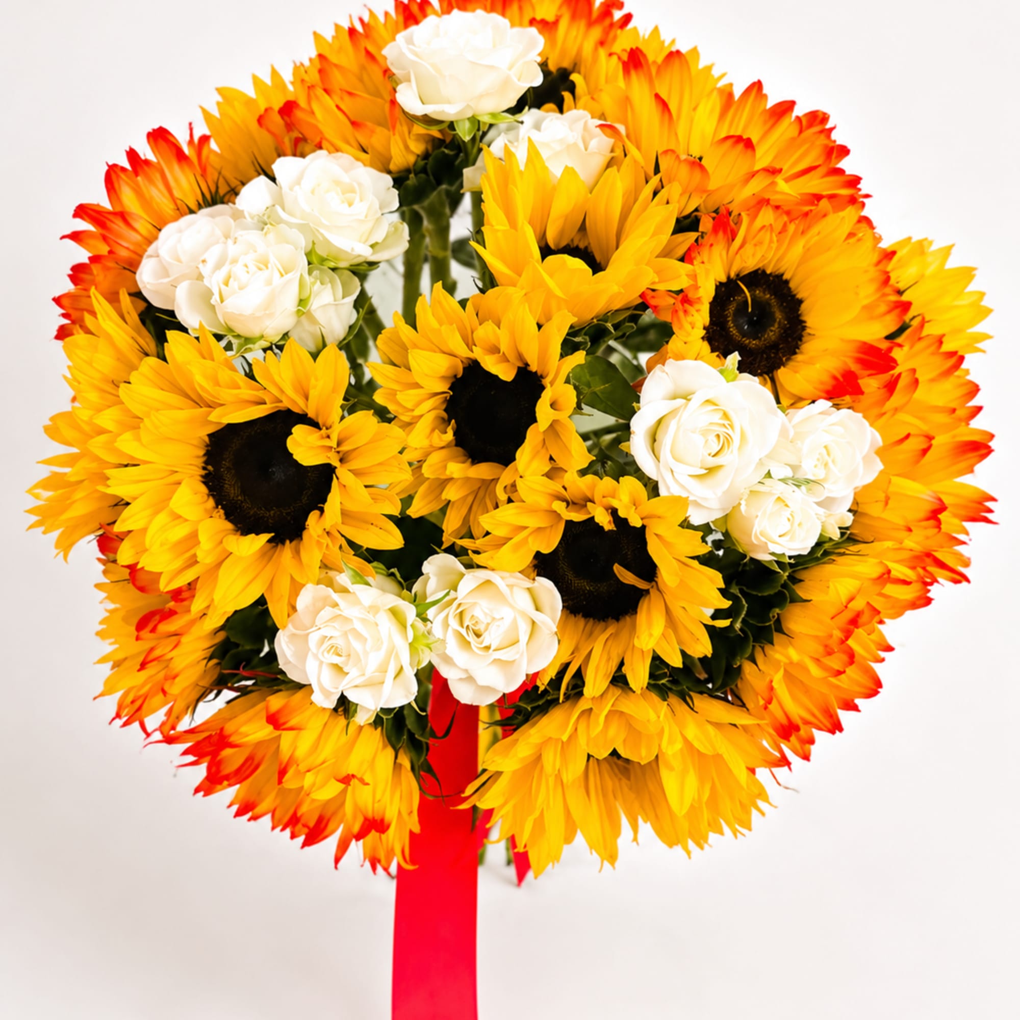 Bouquet of yellow sunflowers and white roses with a red ribbon