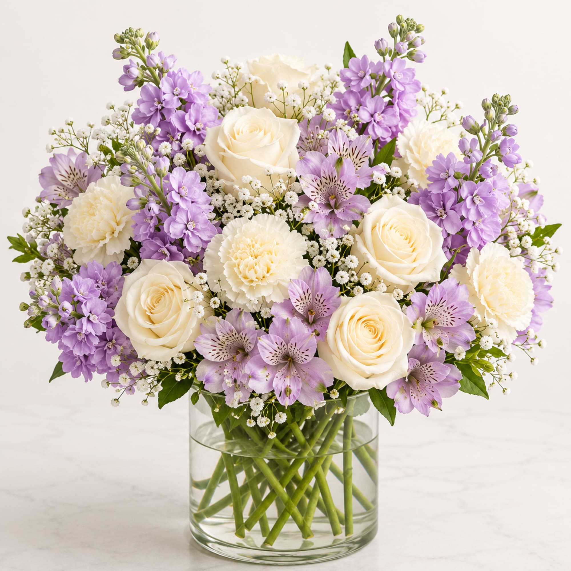 Elegant, peaceful, and timeless, Lavender Grace Bouquet&trade; showcases a beautiful blend of