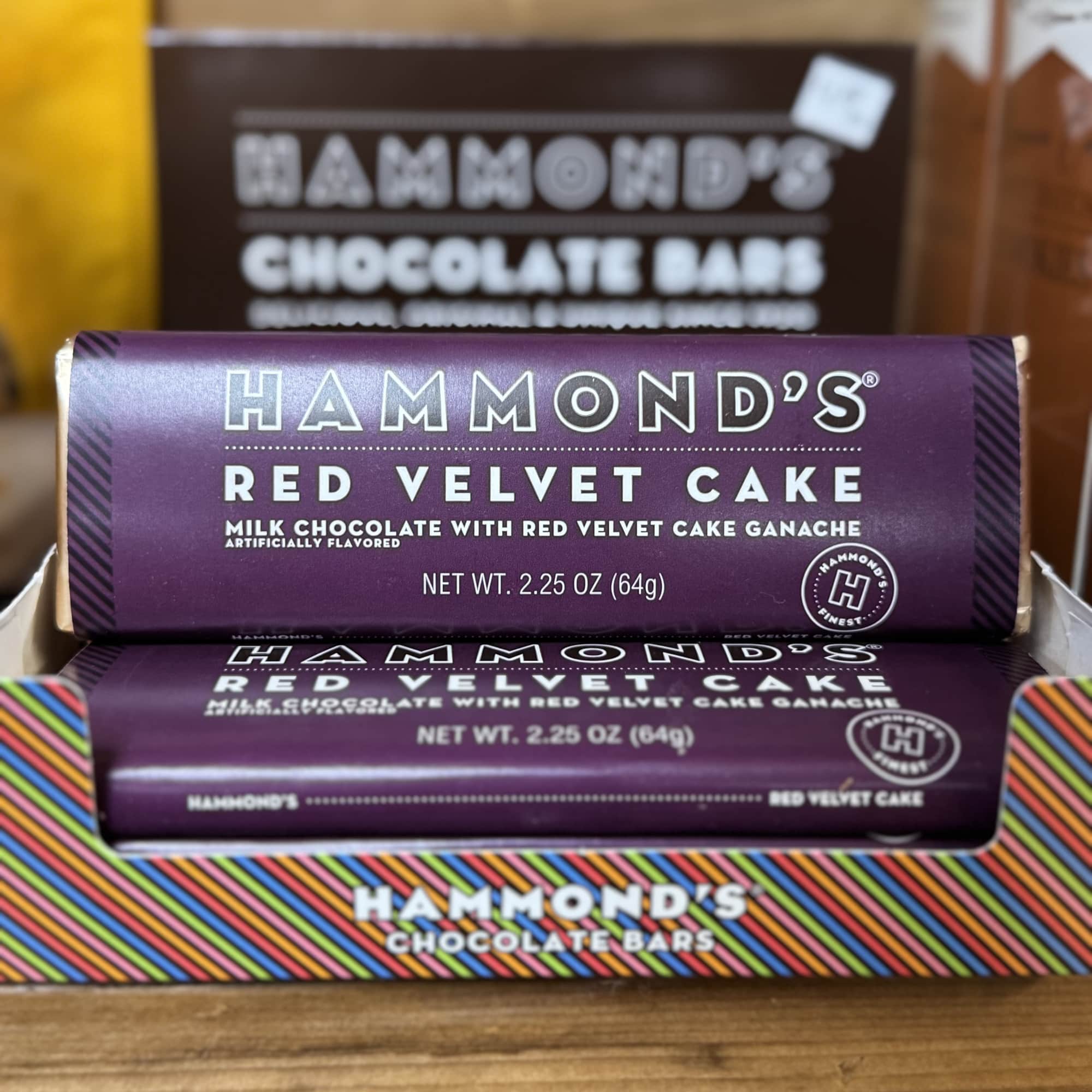Stacked Hammond's chocolate bars in purple and rainbow-striped wrappers