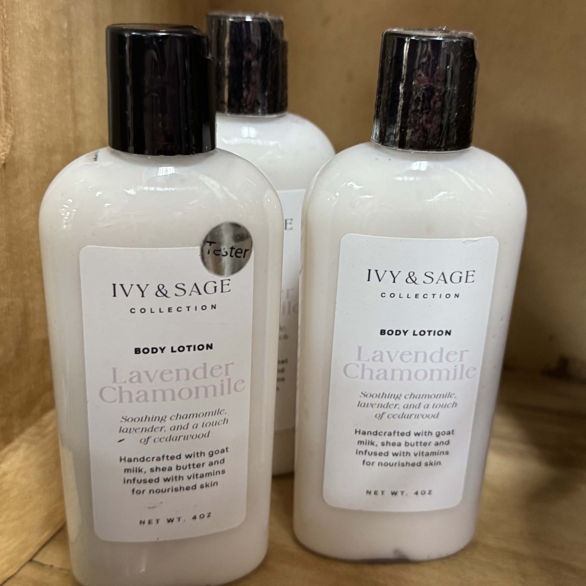 Three bottles of Ivy & Sage lavender chamomile body lotion on a shelf