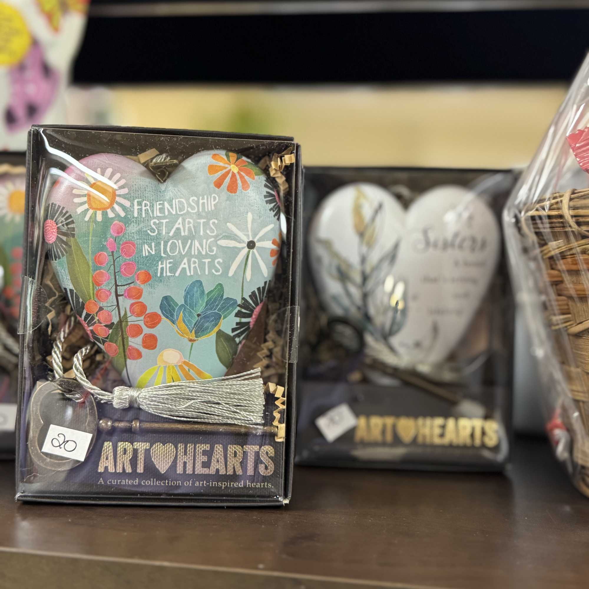 Gift box with a painted heart ornament and tassel