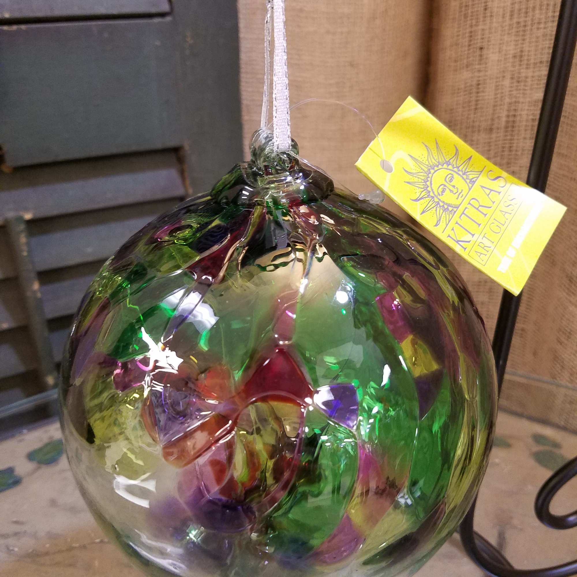 Colorful glass ornament with a hanging ribbon