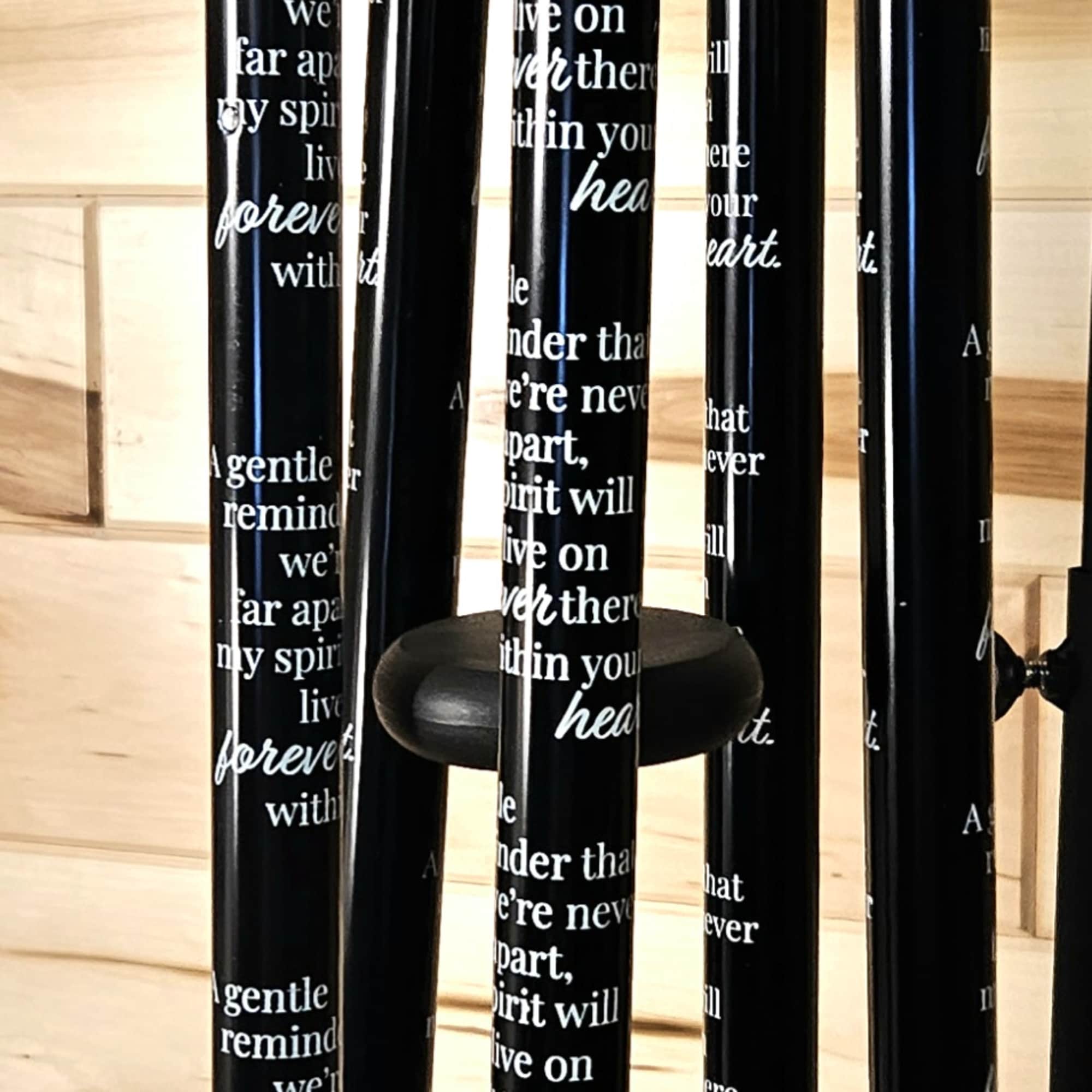 Black memorial wind chime with engraved tubes and butterfly pendant