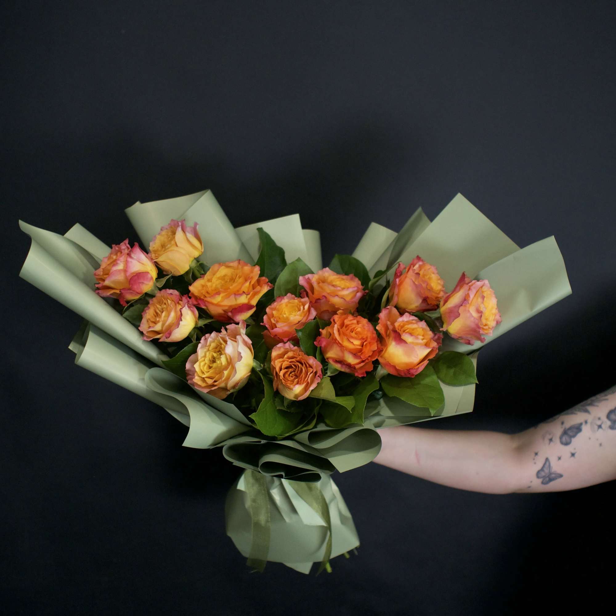A contemporary bouquet featuring twelve stunning Free Spirit roses, thoughtfully designed with