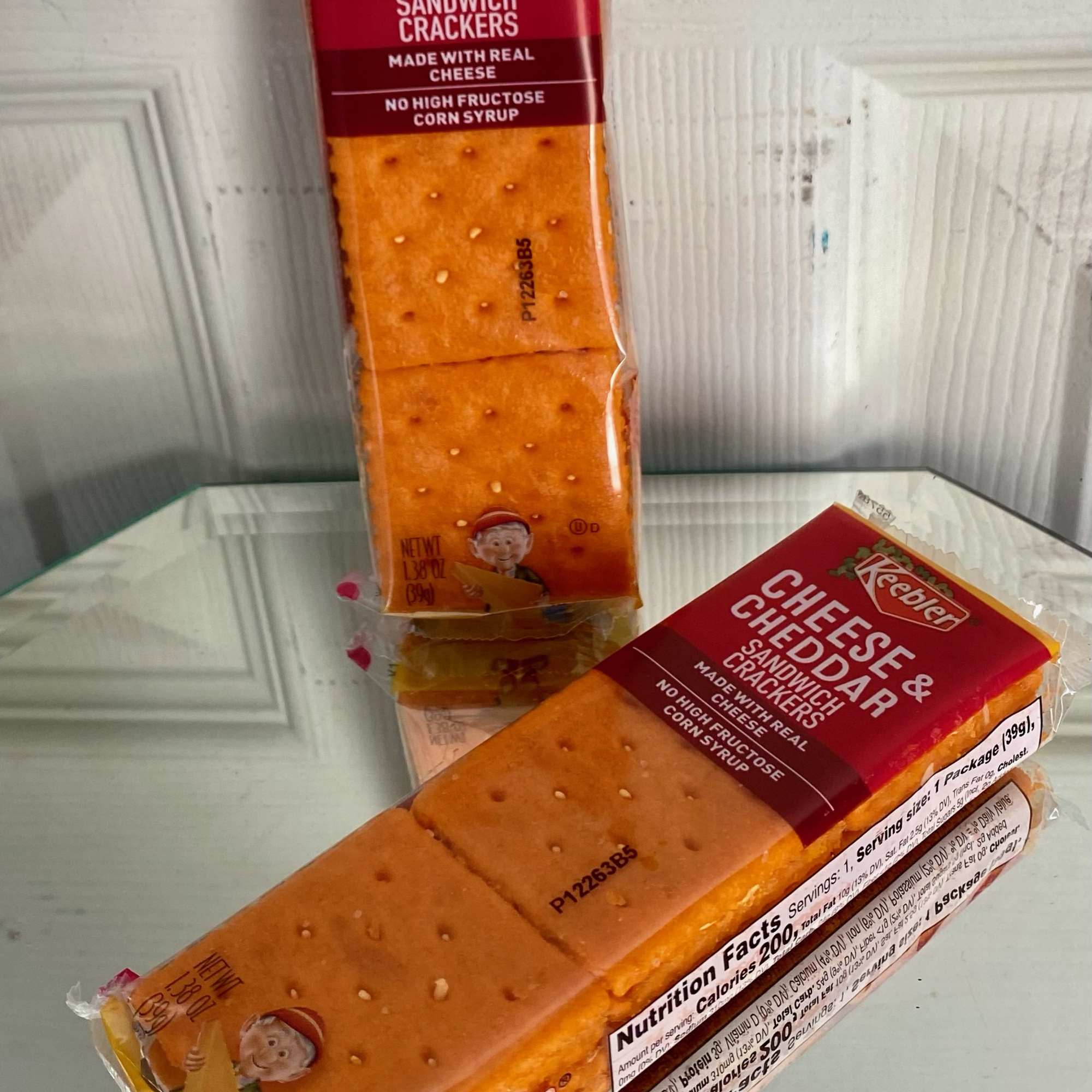 Two packages of Keebler cheese and cheddar sandwich crackers