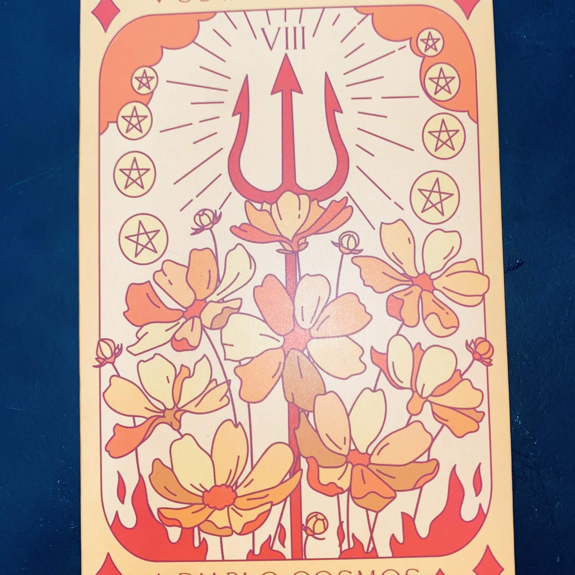 Illustrated tarot-style card with flowers and a trident