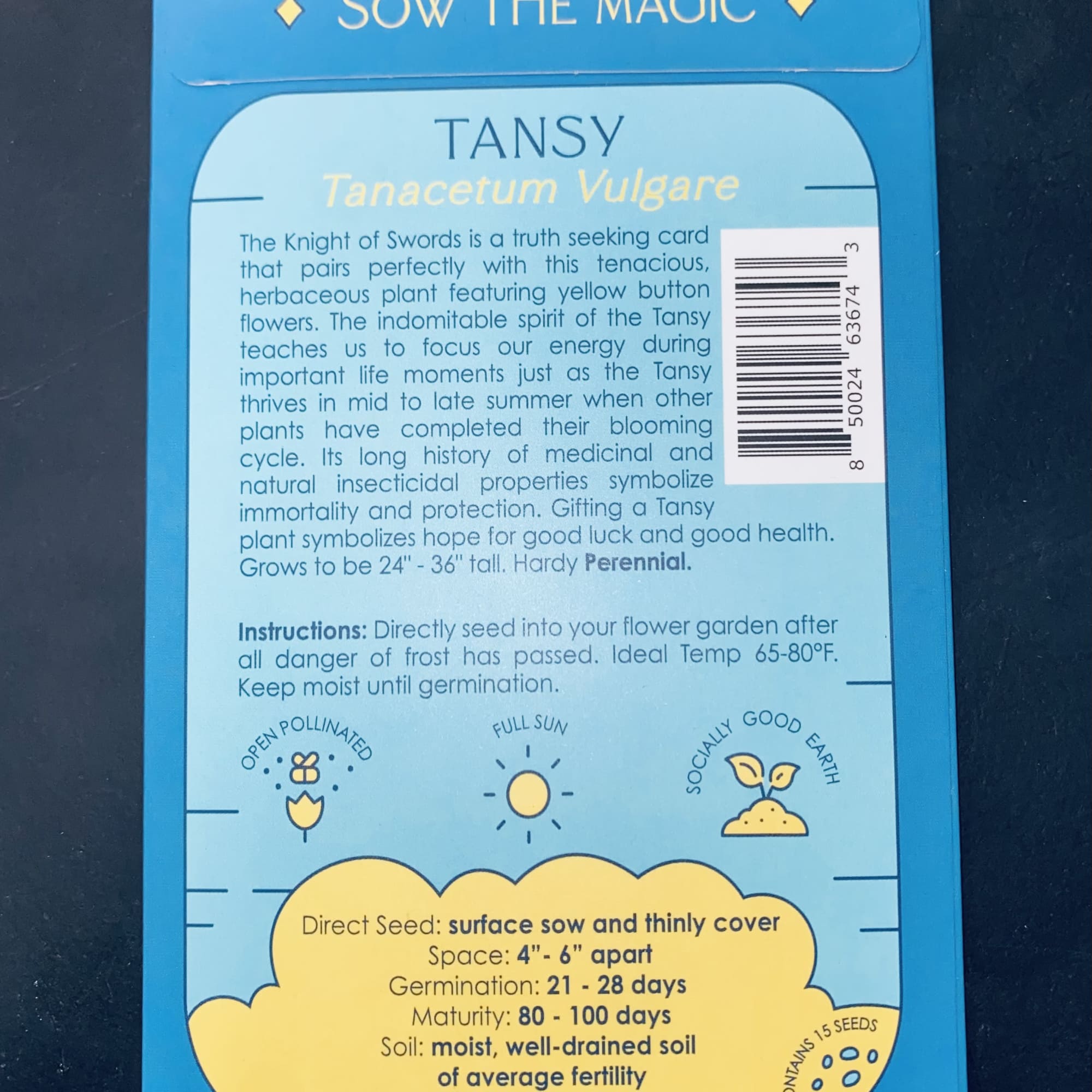 Blue seed packet labeled tansy with planting instructions
