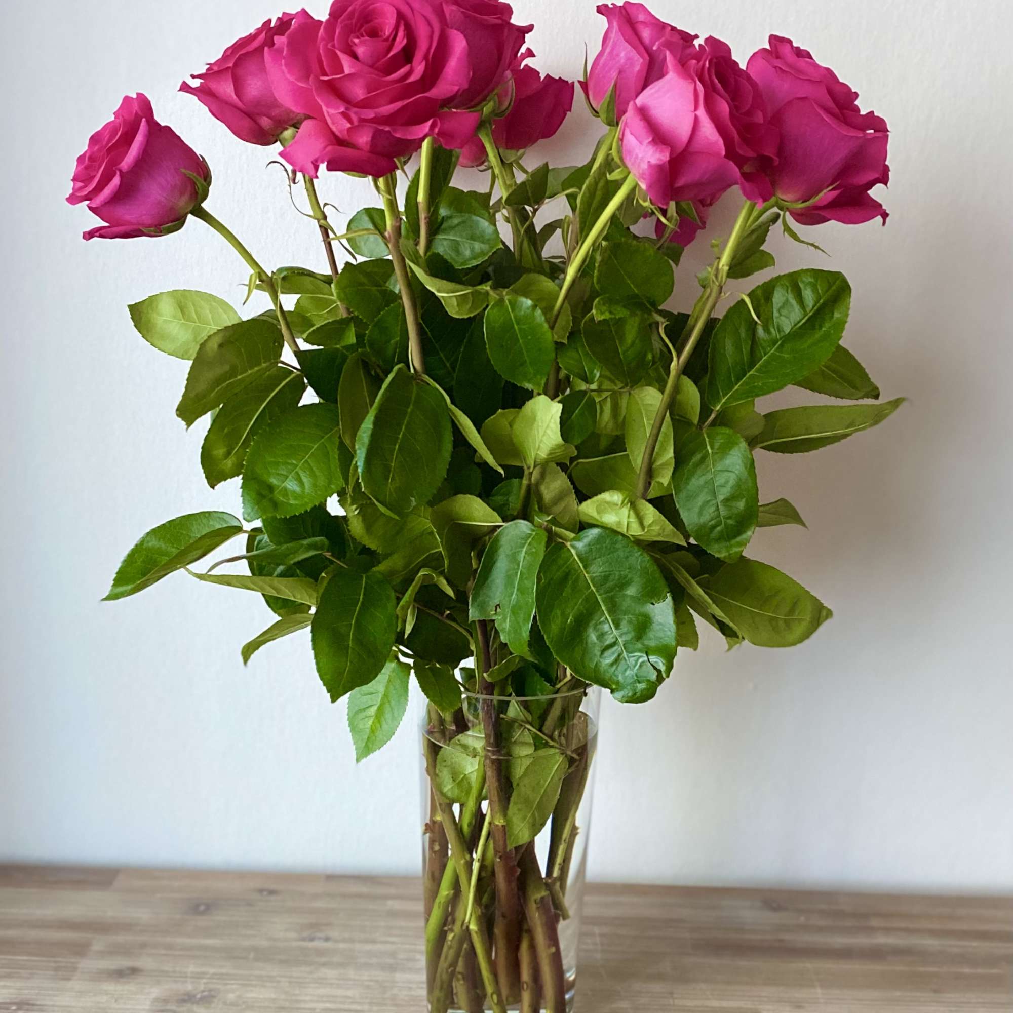 Pink roses in a clear glass vase