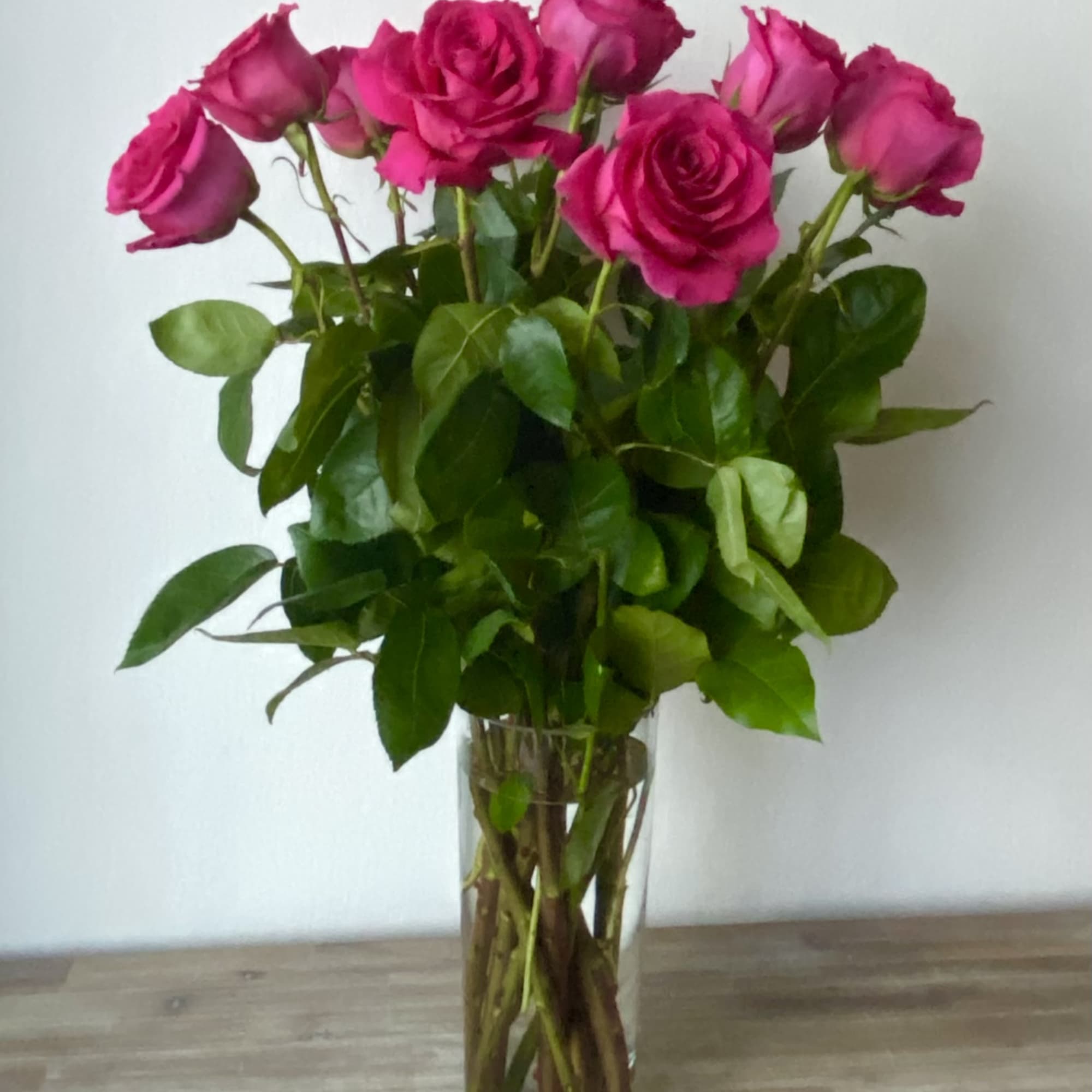 Pink roses in a clear glass vase