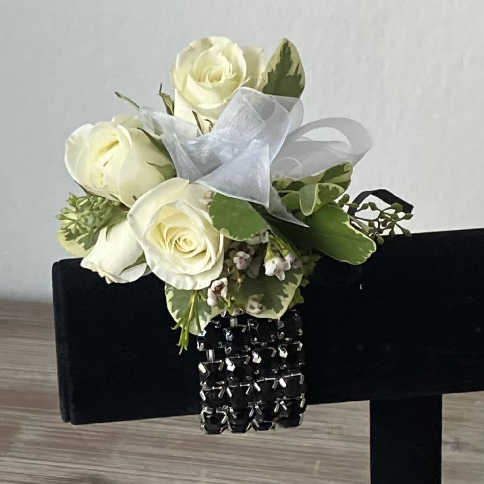 White rose bouquet with sheer ribbon and black beaded bracelet