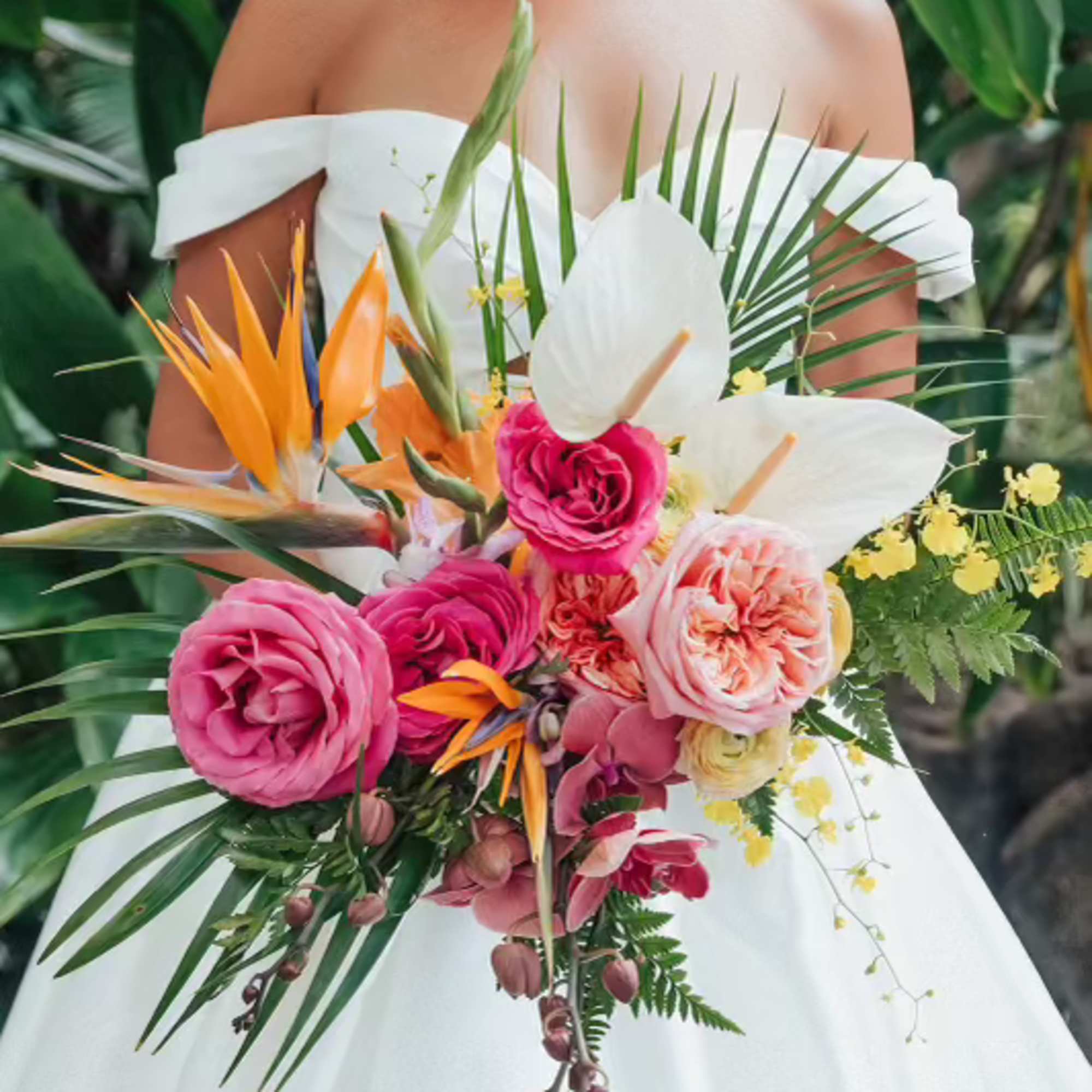 Bride holding a tropical bouquet with pink roses and white anthuriums