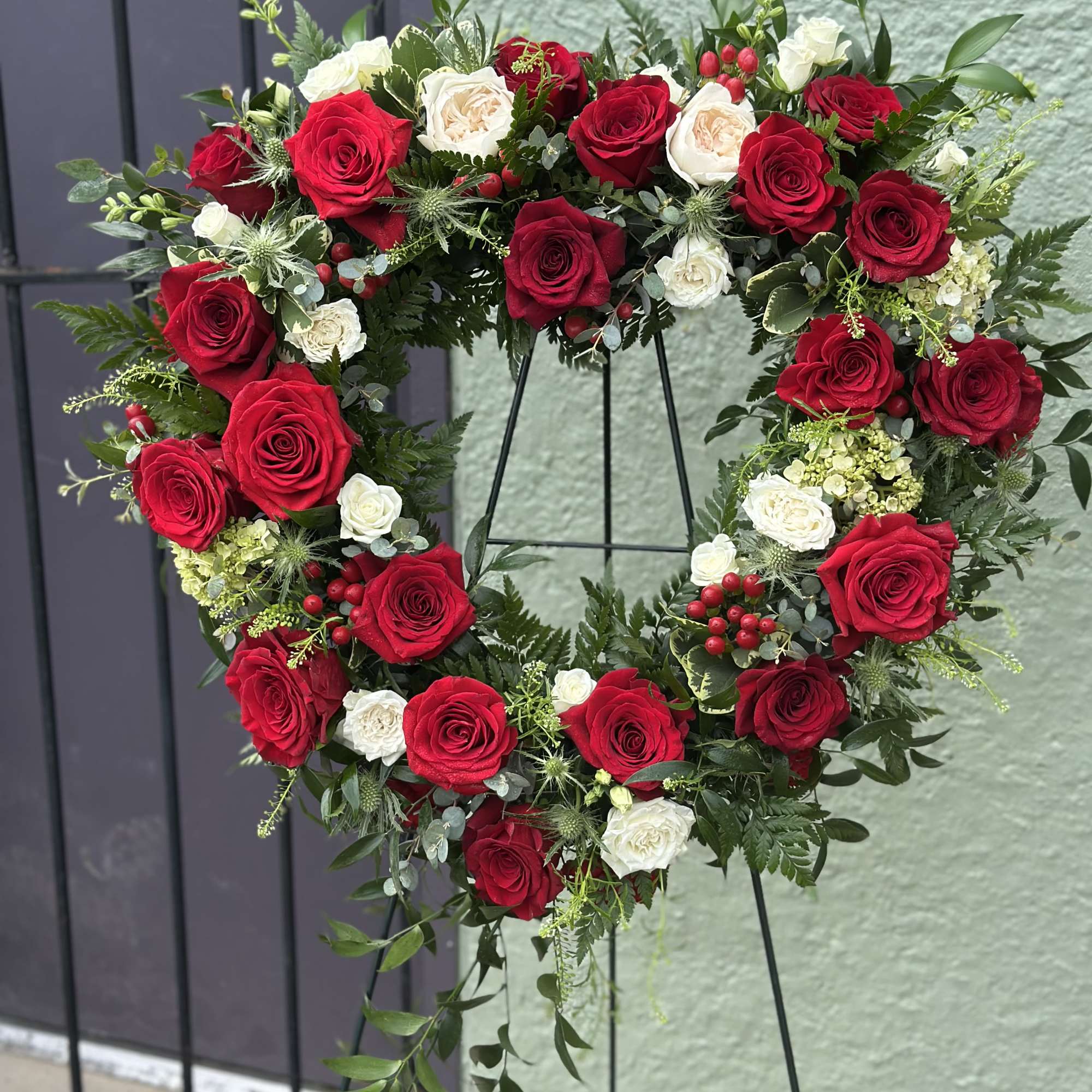 A large(about 24" cross) open heart-shaped floral wreath that speaks of enduring