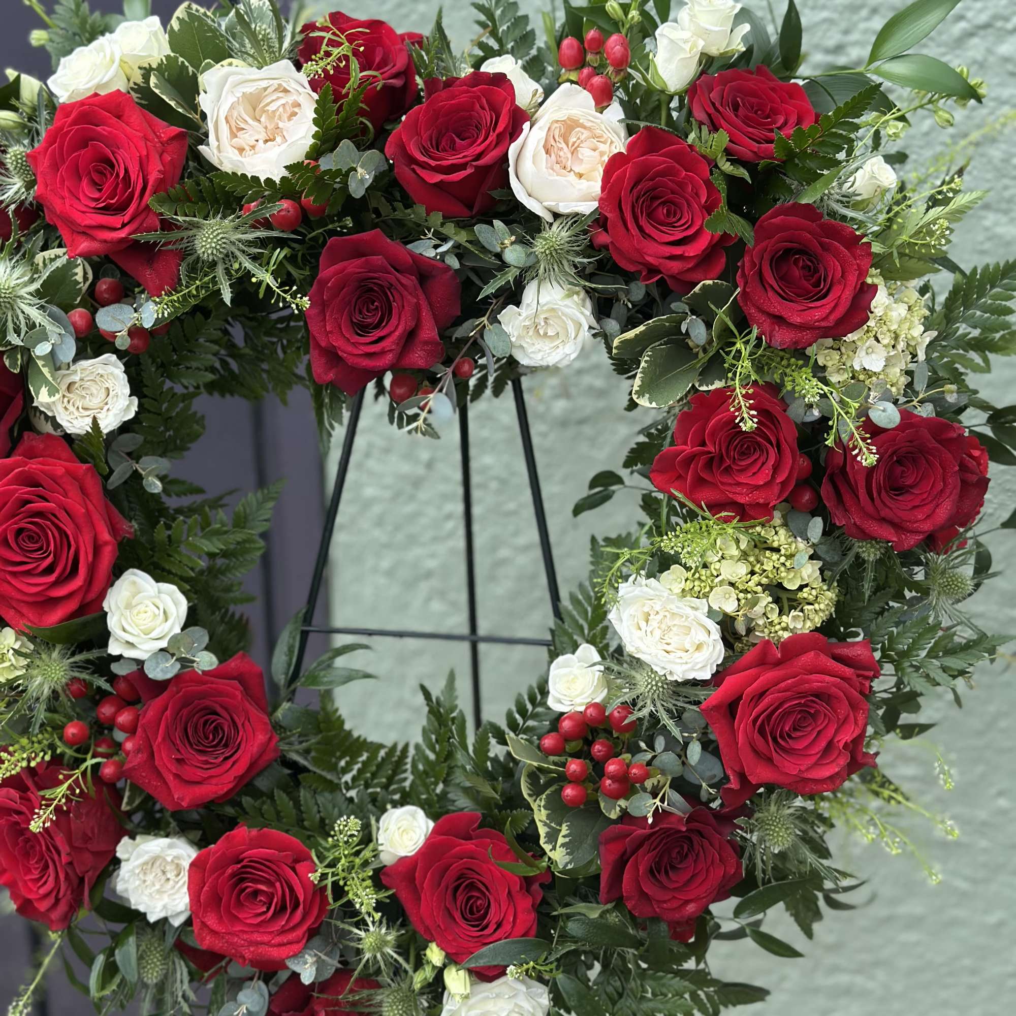A large(about 24" cross) open heart-shaped floral wreath that speaks of enduring