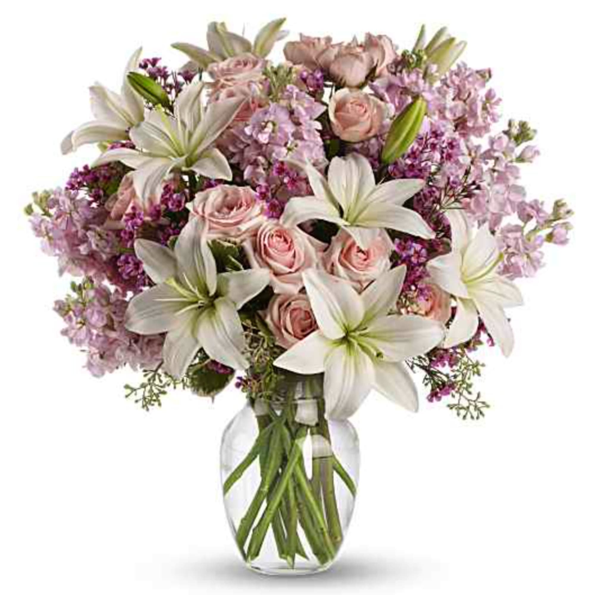 Pink roses and white lilies in a clear glass vase