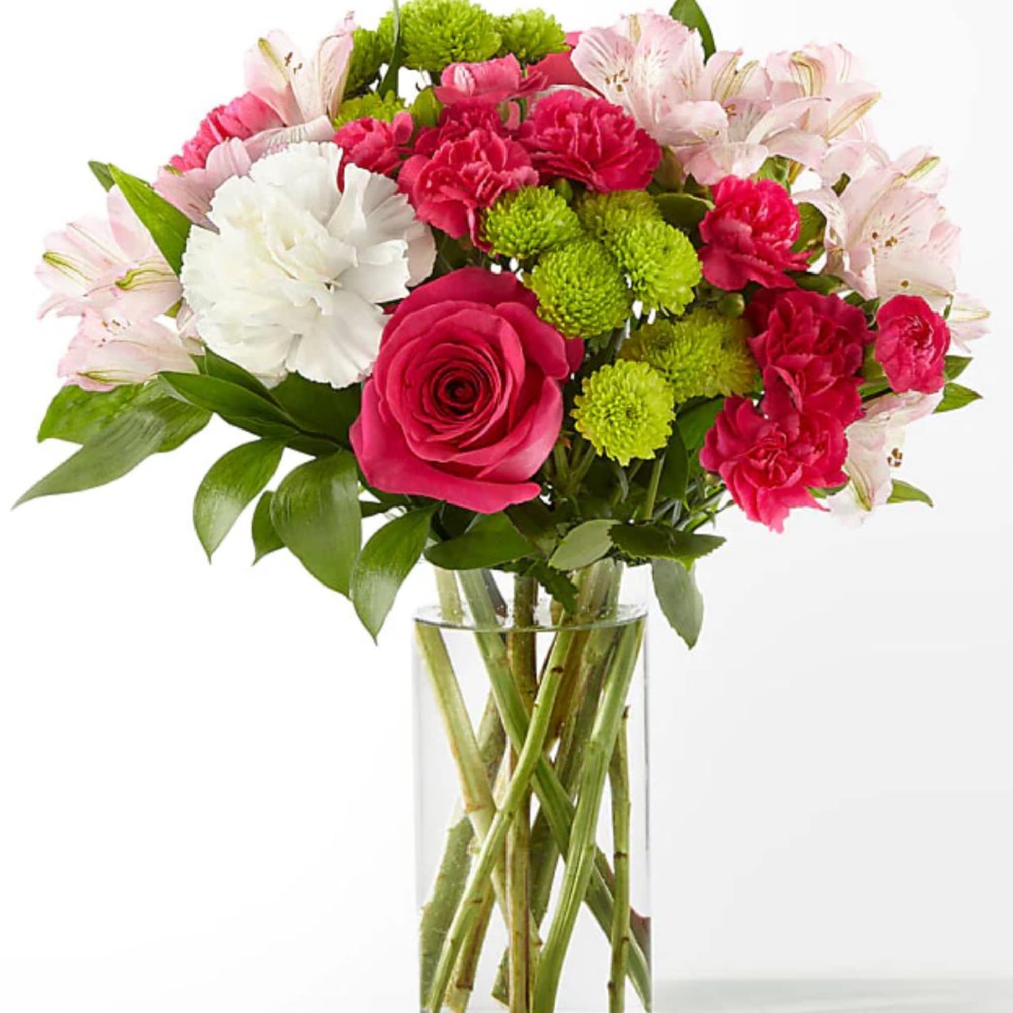 Bouquet of pink and white flowers in a clear glass vase