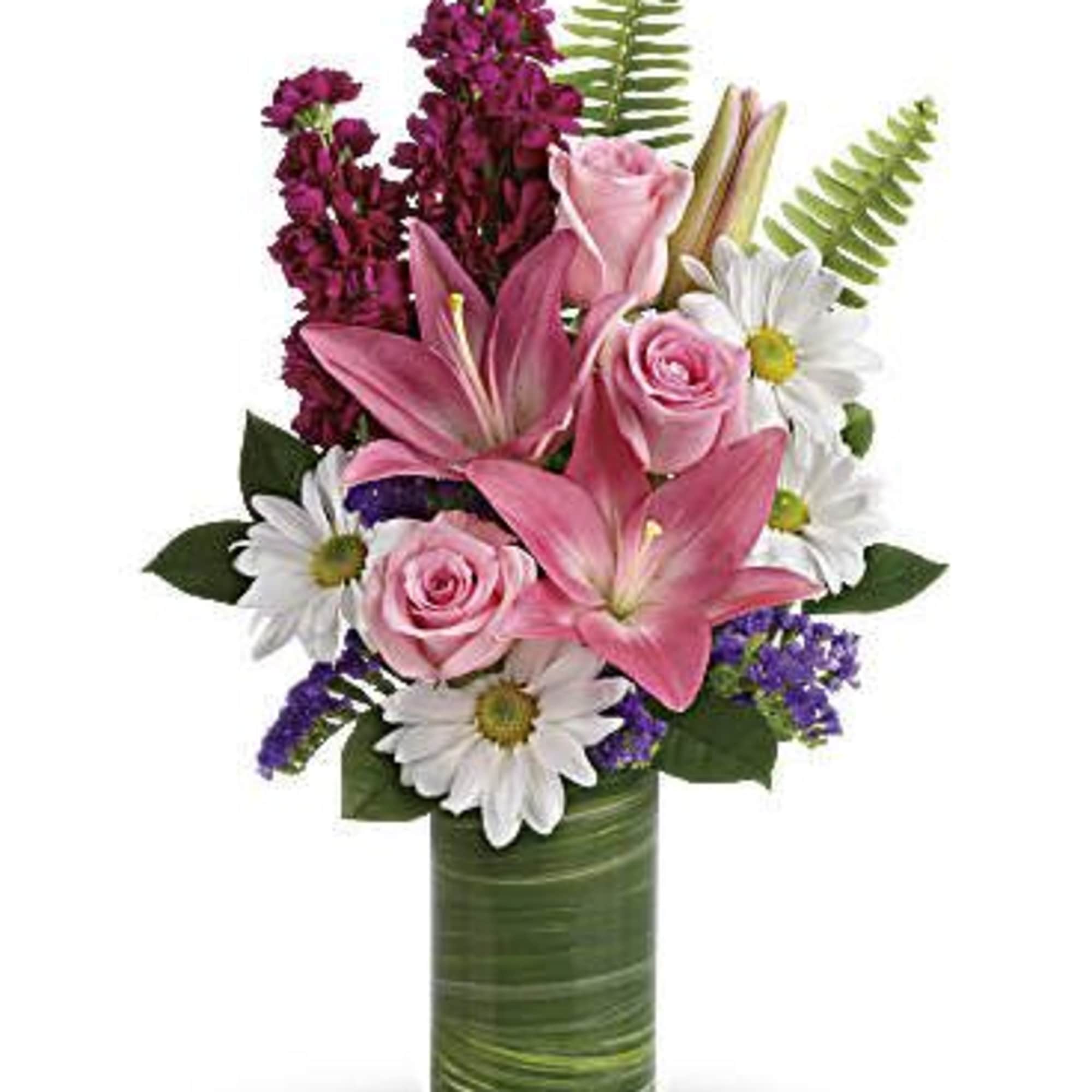 Pink lilies and roses with white daisies in a green vase