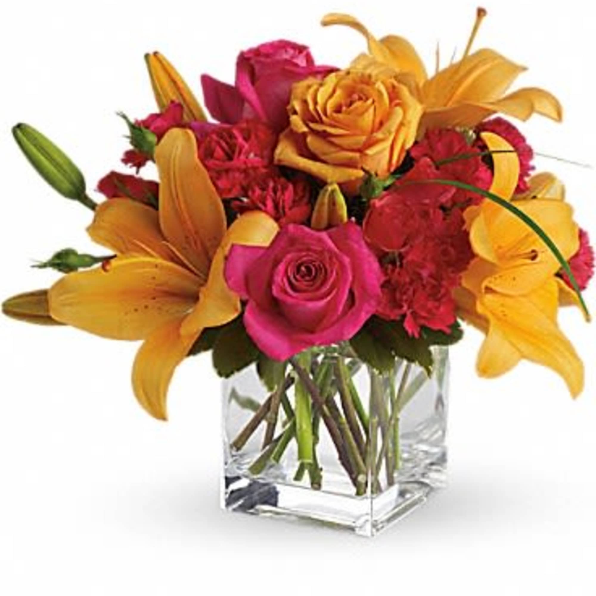 Bouquet of pink roses and yellow lilies in a clear glass vase